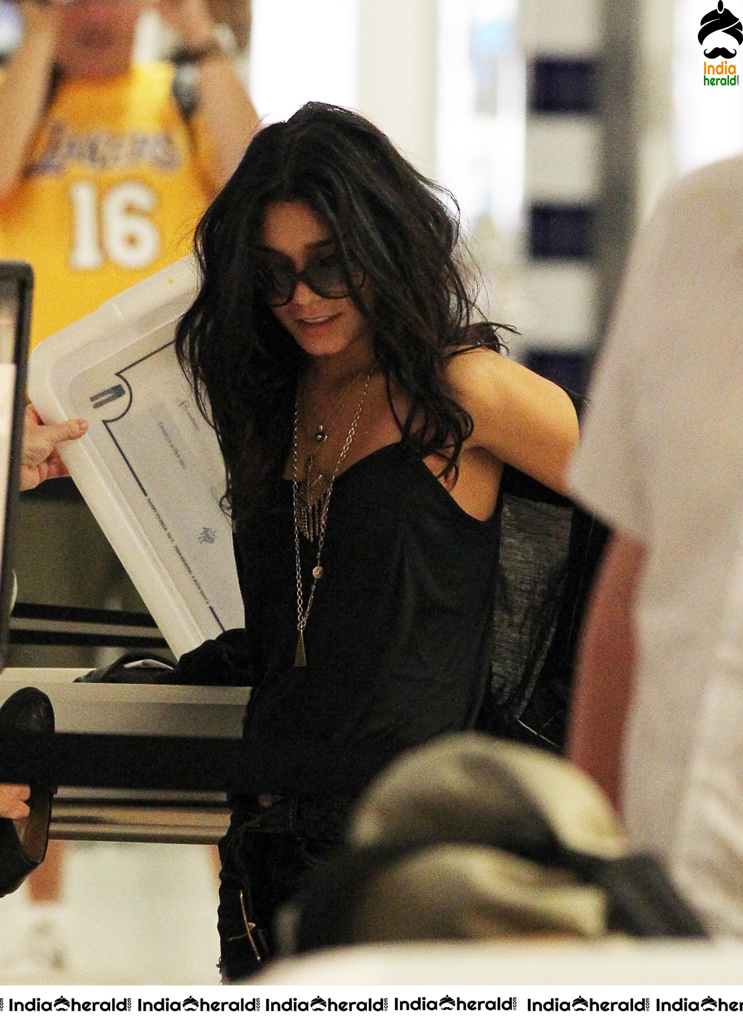 Vanessa Hudgens Exposing her Brassiere in a Transparent Black Top at JFK Airport