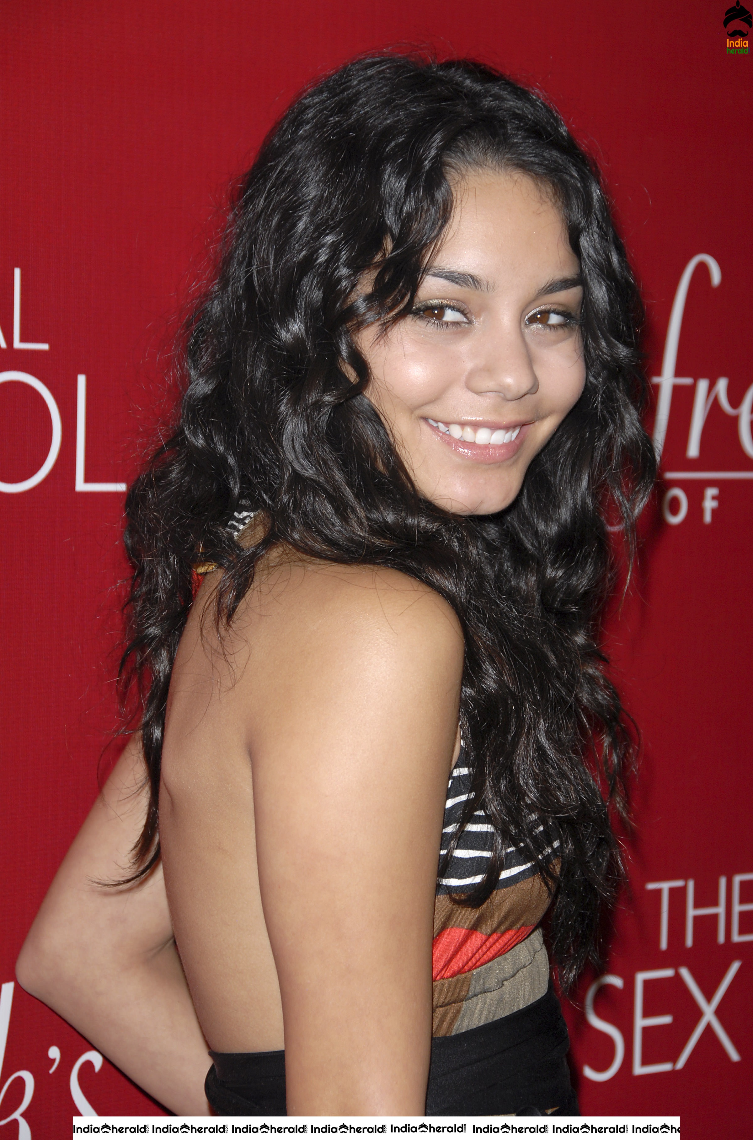 Vanessa Hudgens Flaunts her Smile and her Sexy Back at Fredricks of Hollywood Fashion Show