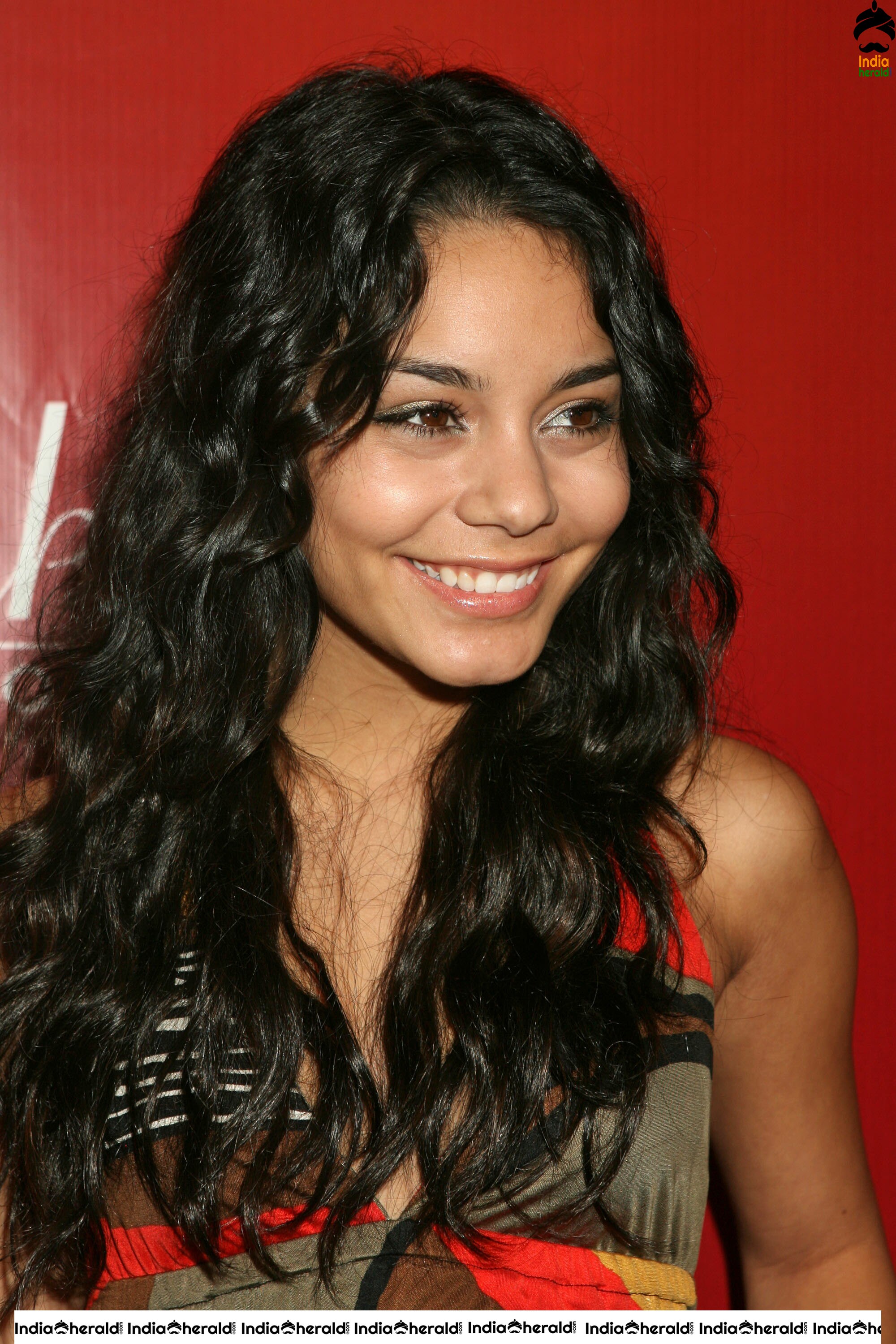 Vanessa Hudgens Flaunts her Smile and her Sexy Back at Fredricks of Hollywood Fashion Show