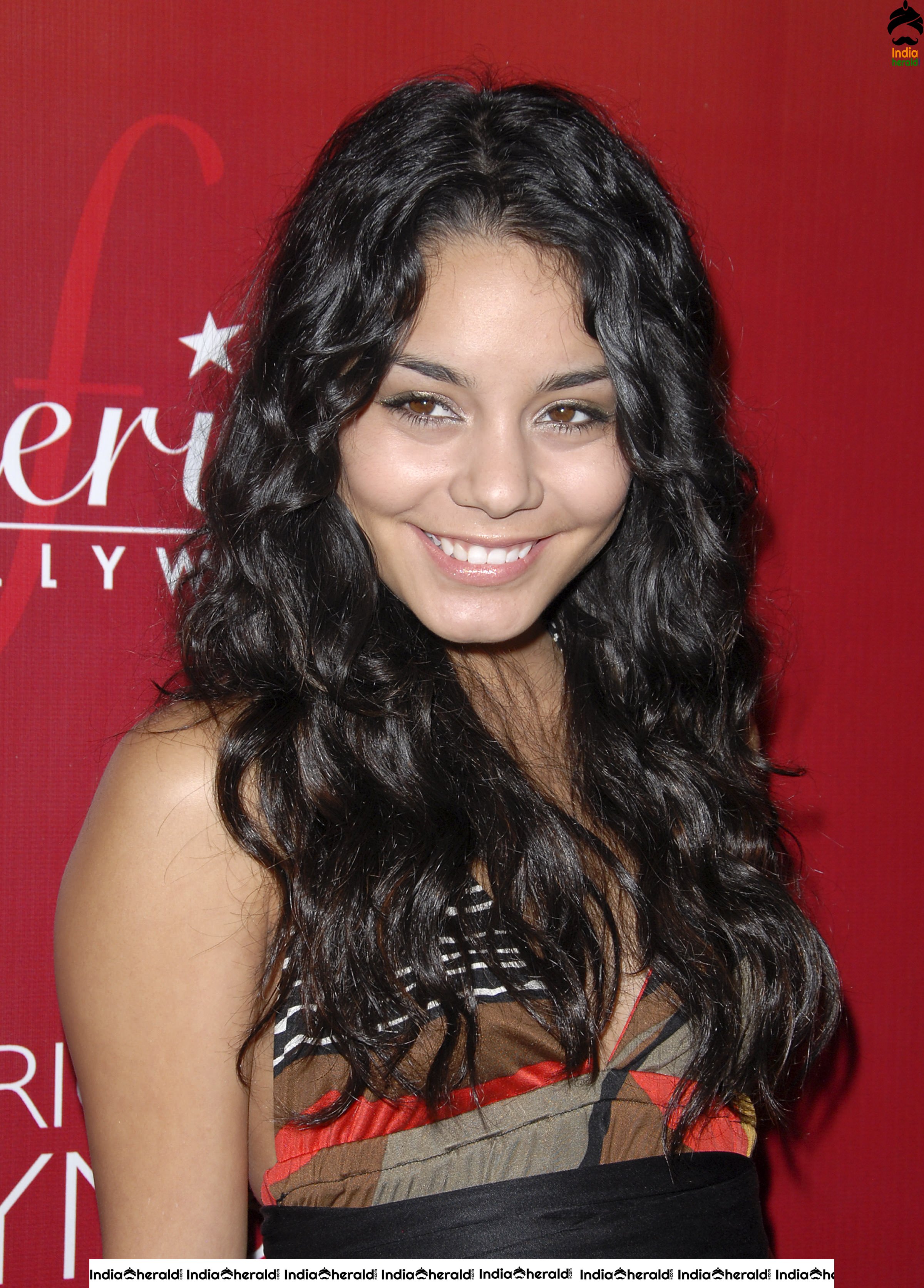 Vanessa Hudgens Flaunts her Smile and her Sexy Back at Fredricks of Hollywood Fashion Show