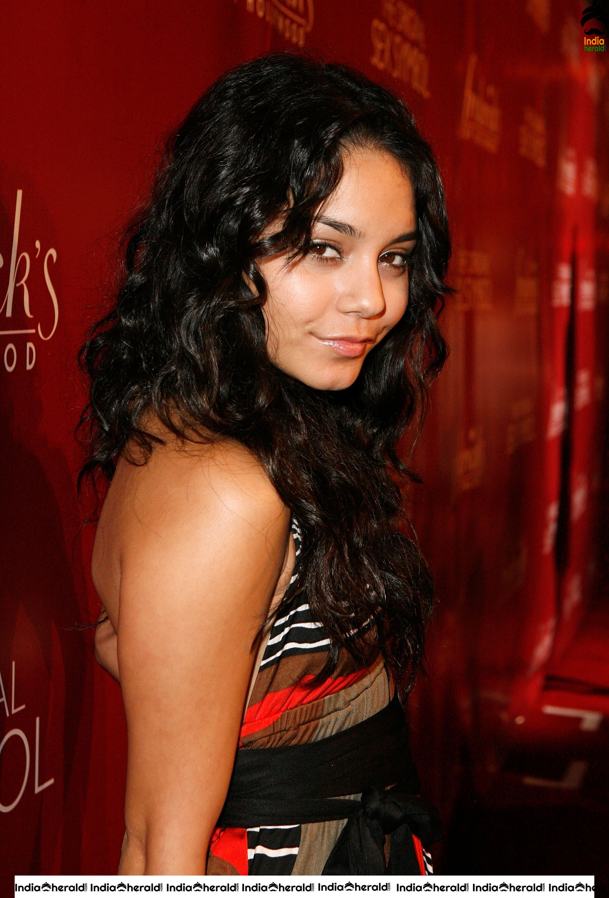 Vanessa Hudgens Flaunts her Smile and her Sexy Back at Fredricks of Hollywood Fashion Show