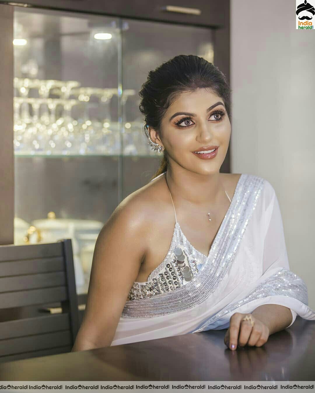 Yashika Aannand Hot And Cute Sleeveless Blouse white Transparent Saree Stills