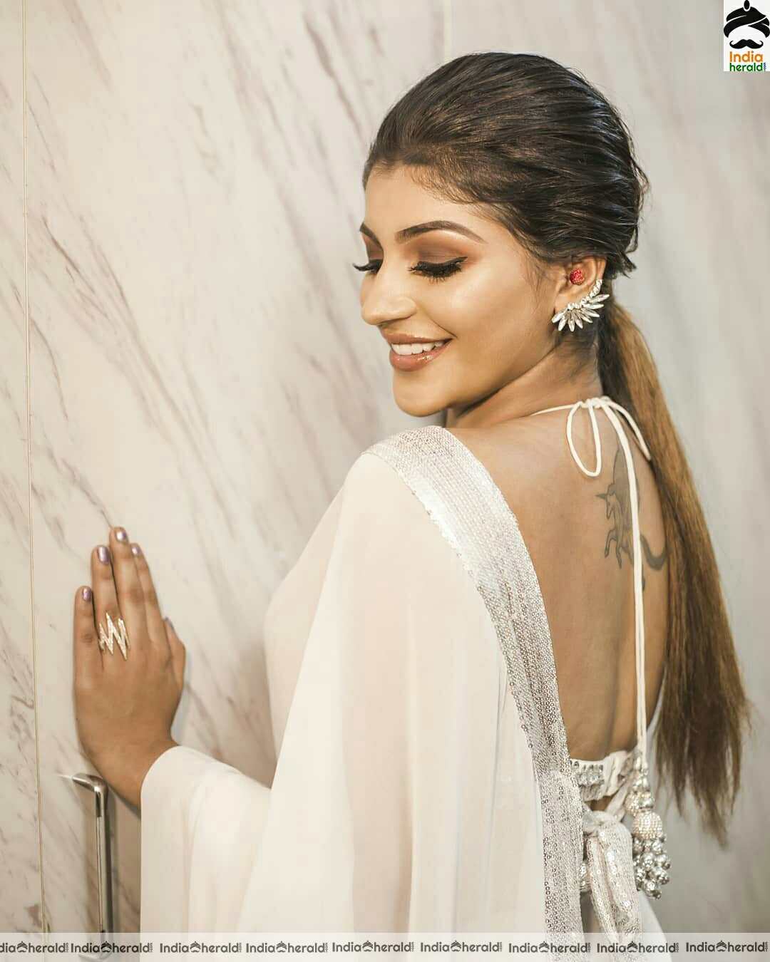 Yashika Aannand Hot And Cute Sleeveless Blouse white Transparent Saree Stills