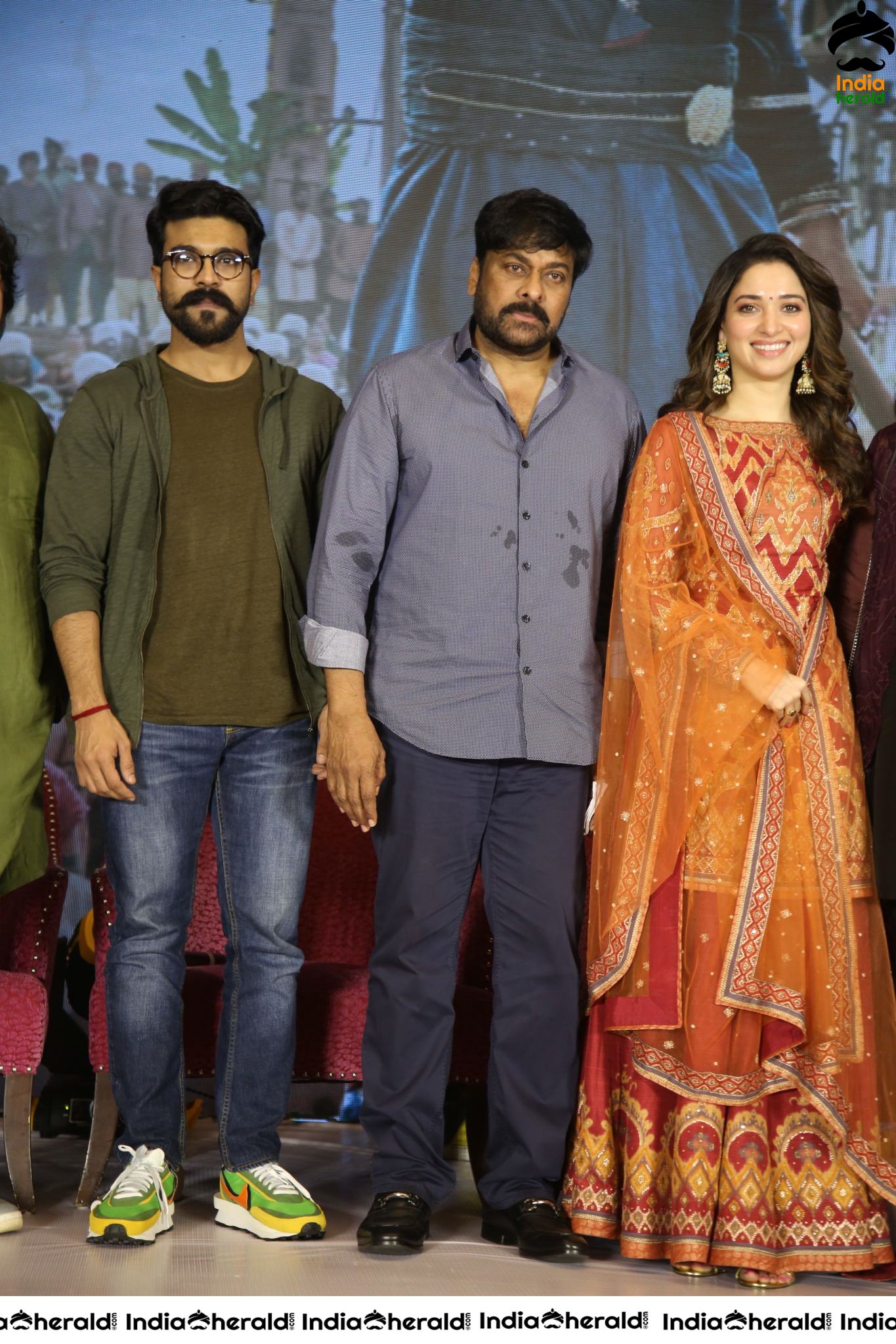 Chiranjeevi Tamanna and Ram Charan from the stage of Sye Raa Thank You Meet Set 4