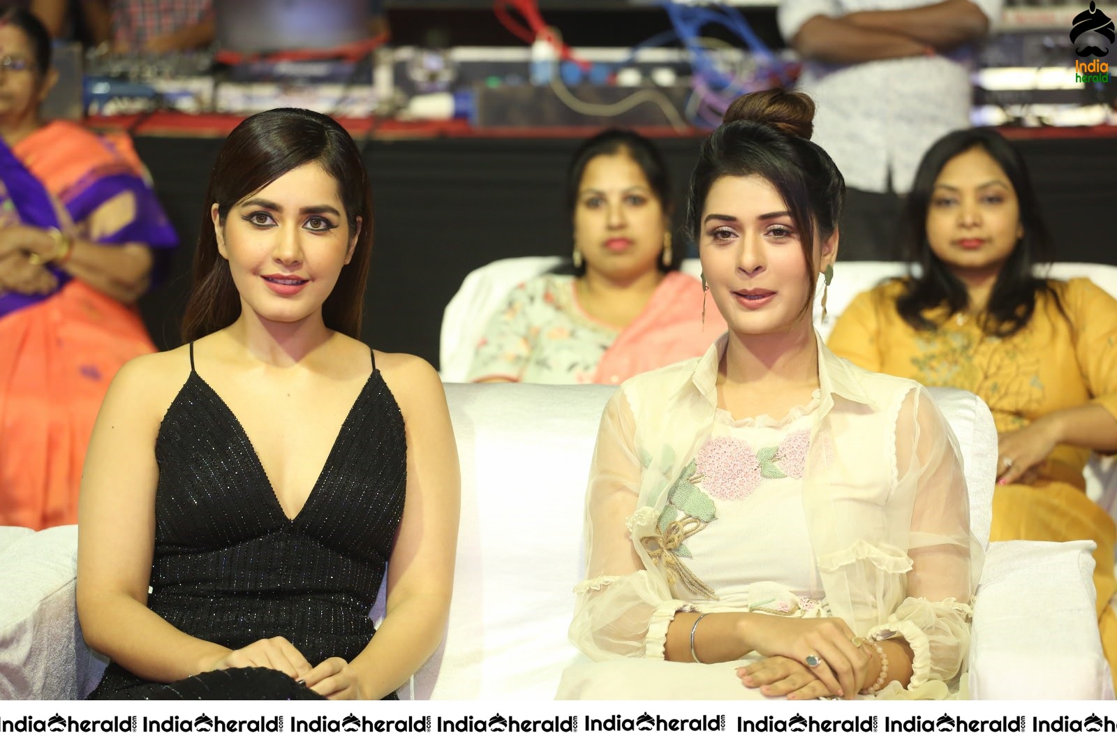 Payal Rajput and Raashi Khanna share a happy moment at Venky Mama Event