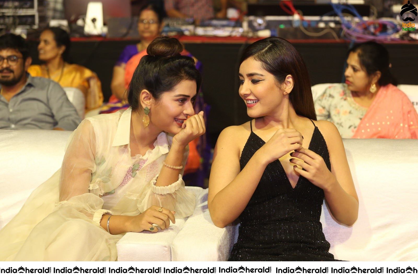 Payal Rajput and Raashi Khanna share a happy moment at Venky Mama Event