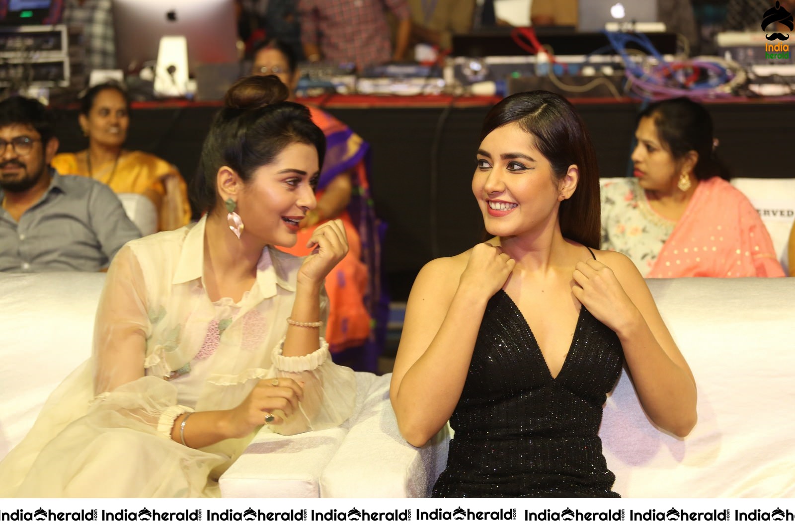 Payal Rajput and Raashi Khanna share a happy moment at Venky Mama Event