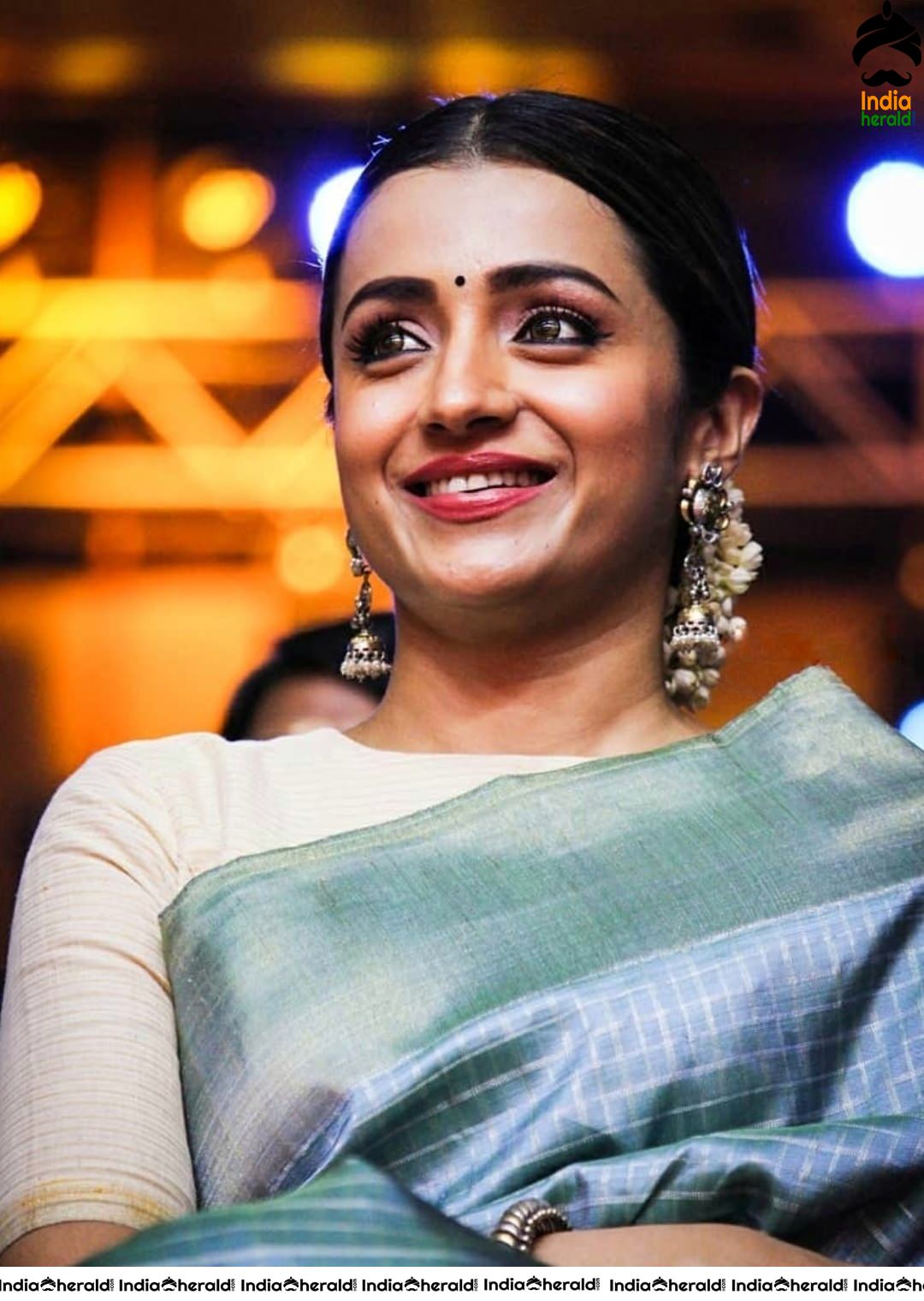 Trisha looking like a Newly Married House Wife with Saree and Jasmine Flowers