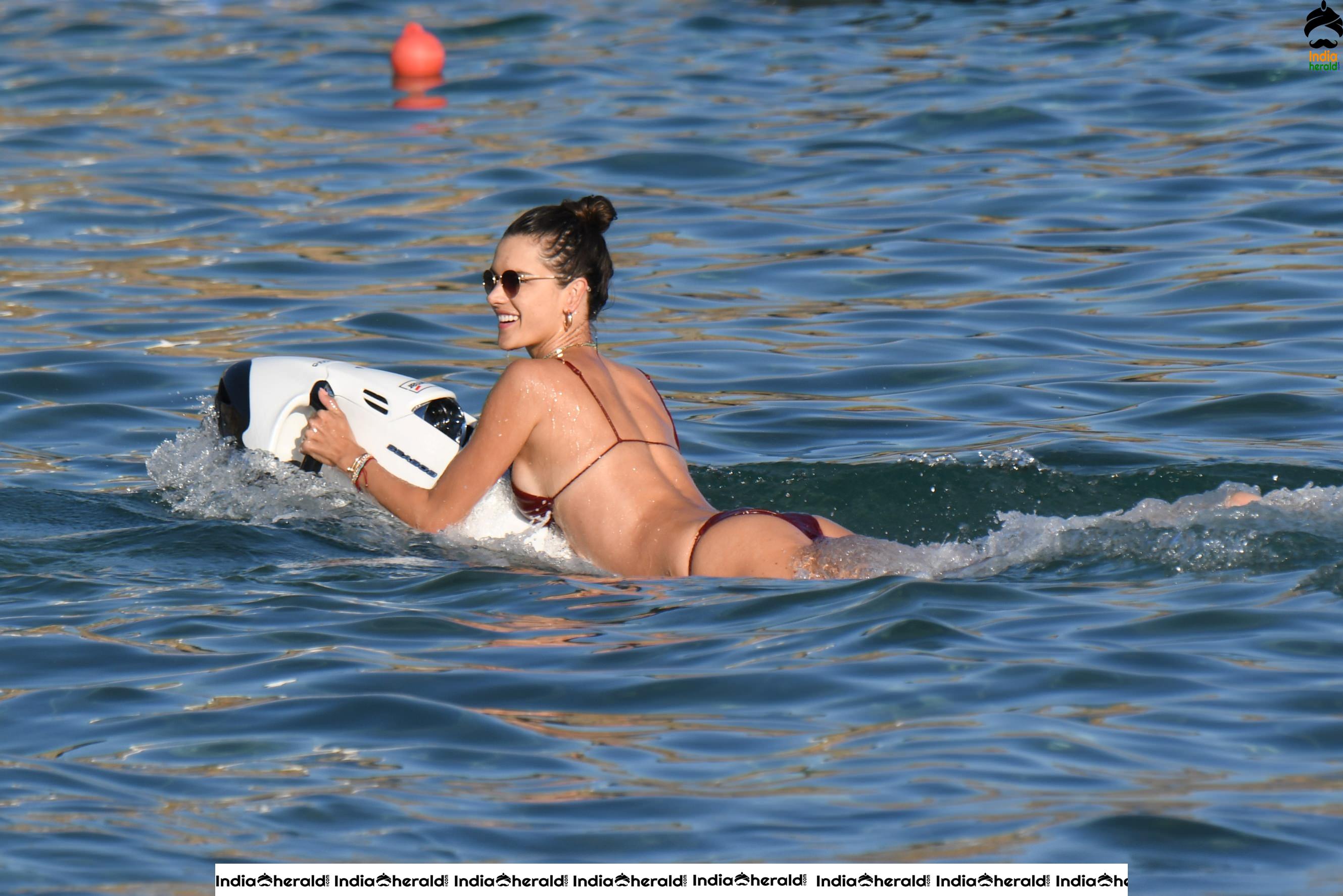 Alessandra Ambrosio Exposing Too Much in String Bikini on the beach in Mykonos Set 2