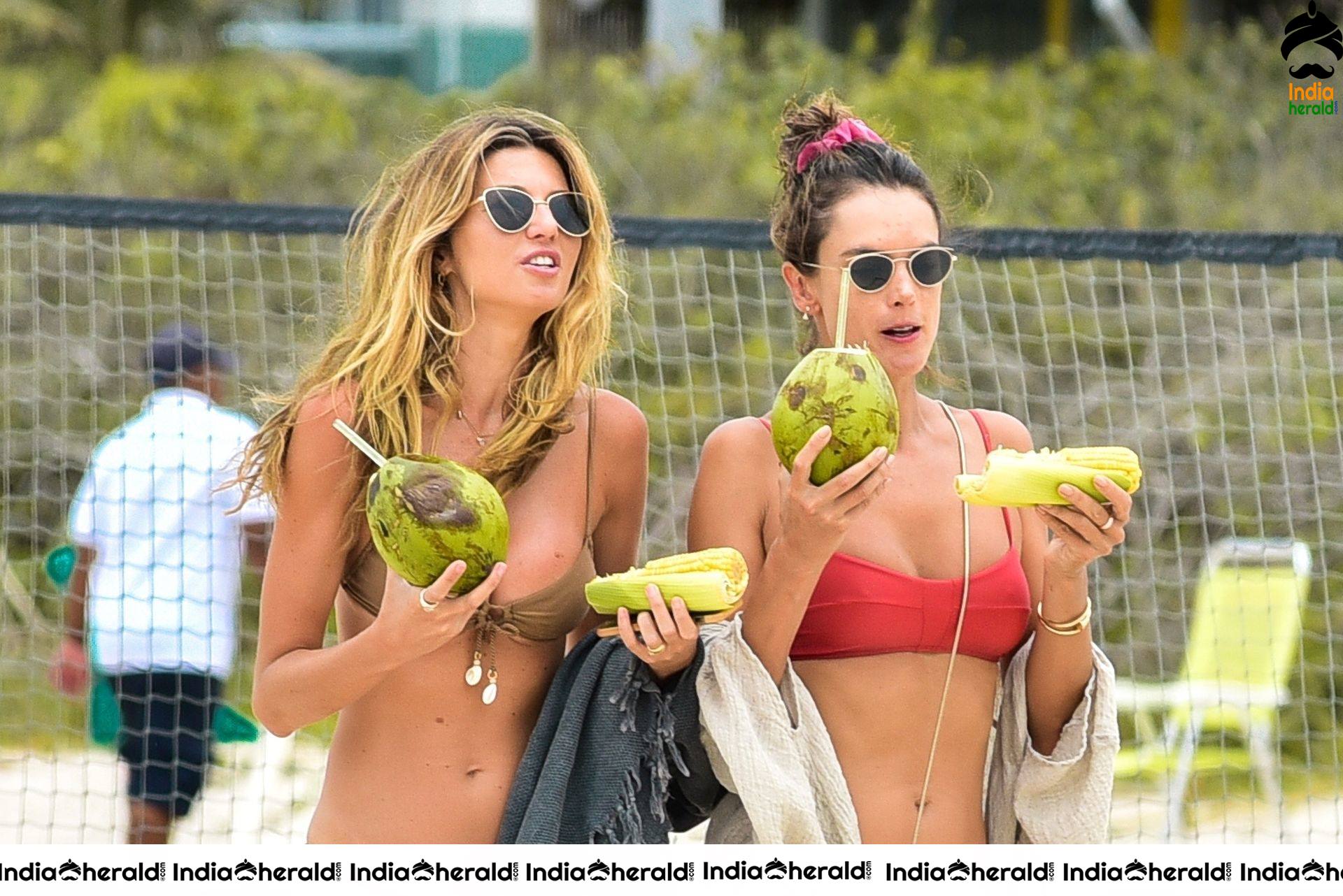 Alessandra Ambrosio in a red bikini at the beach in Florianopolis