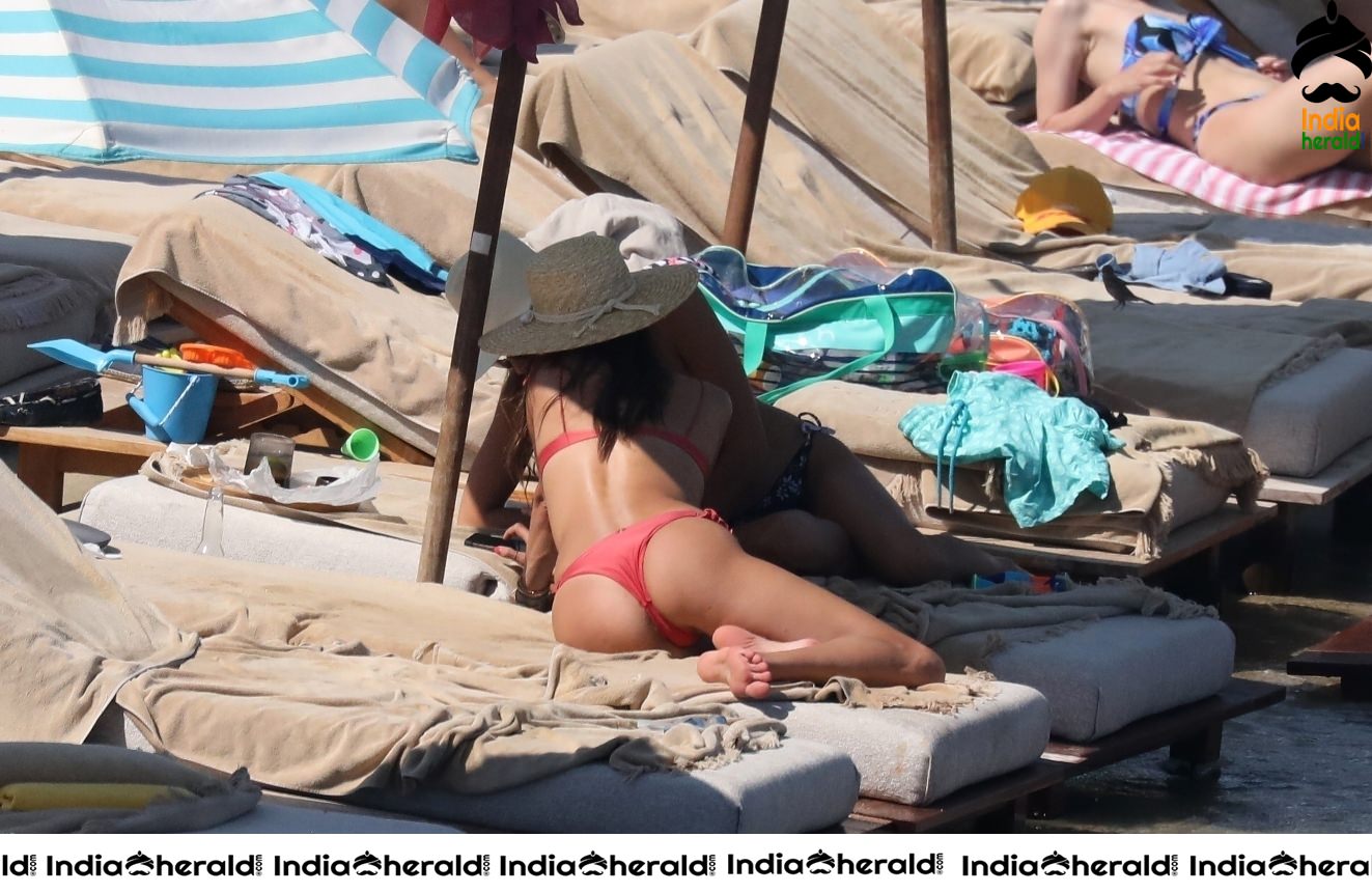 Alessandra Ambrosio in Red Bikini on the beach in Mykonos