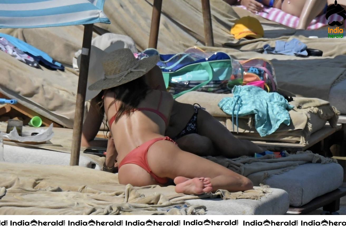 Alessandra Ambrosio in Red Bikini on the beach in Mykonos