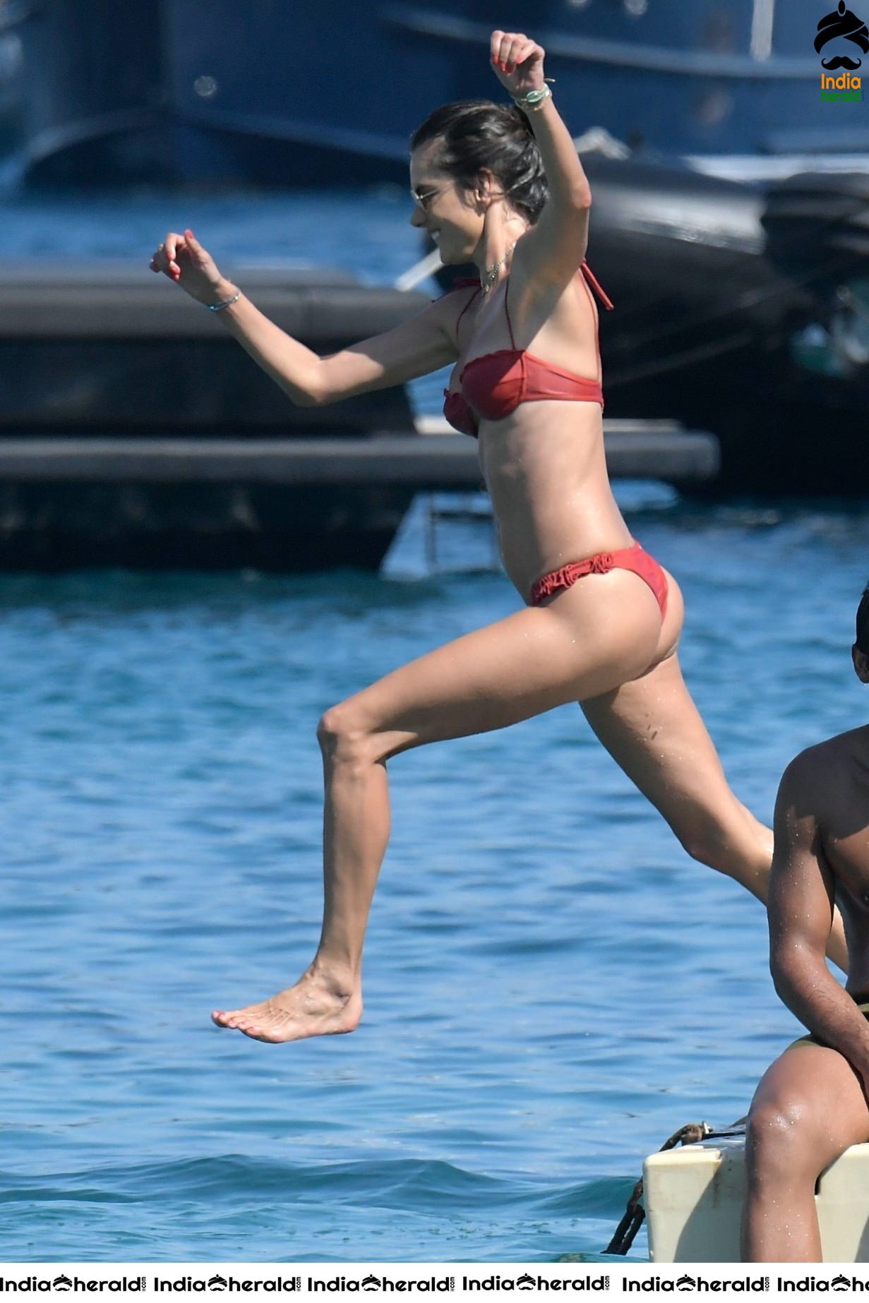 Alessandra Ambrosio in Red Bikini on the beach in Mykonos
