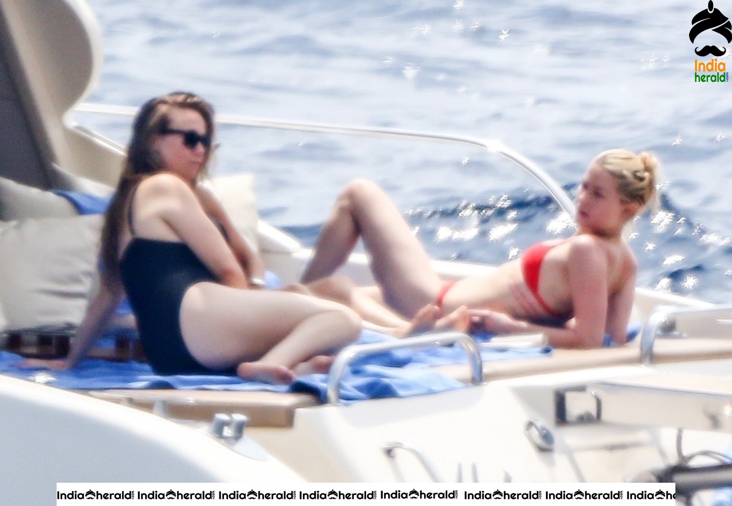 Amber Heard in Two Piece Bikini and enjoys a day with friends on a yacht at the Amalfi Coast