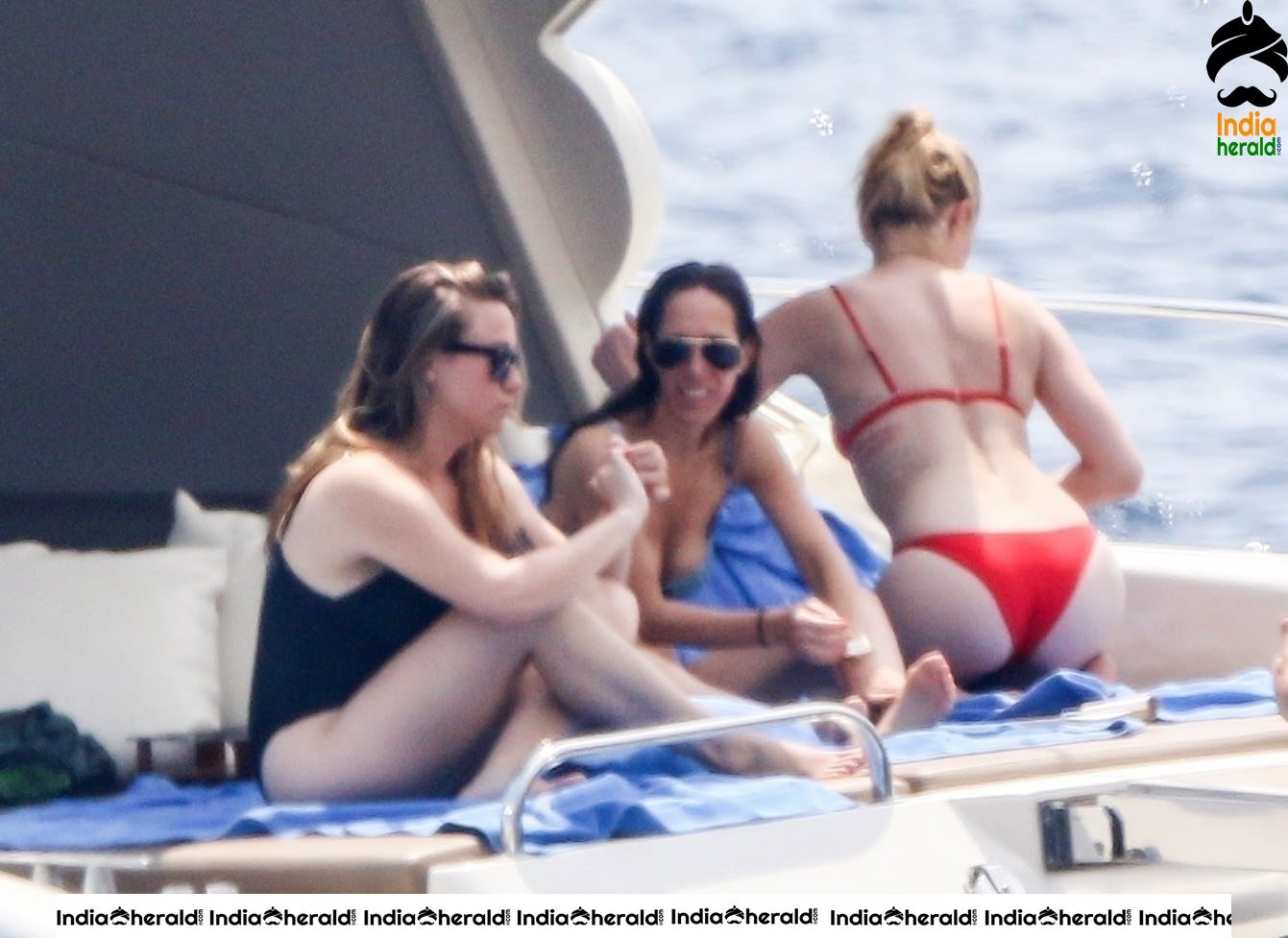 Amber Heard in Two Piece Bikini and enjoys a day with friends on a yacht at the Amalfi Coast