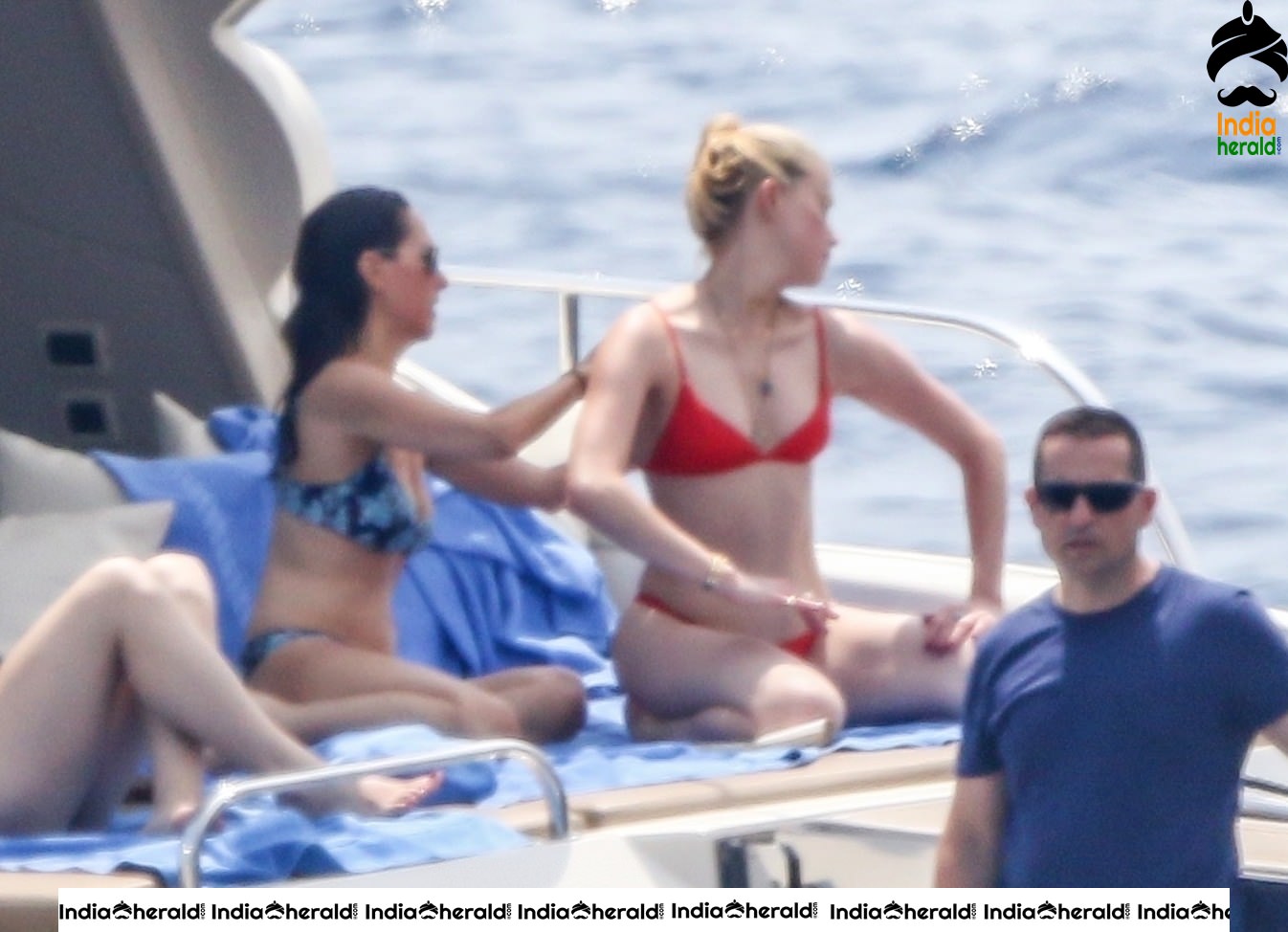 Amber Heard in Two Piece Bikini and enjoys a day with friends on a yacht at the Amalfi Coast
