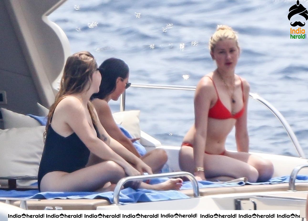 Amber Heard in Two Piece Bikini and enjoys a day with friends on a yacht at the Amalfi Coast