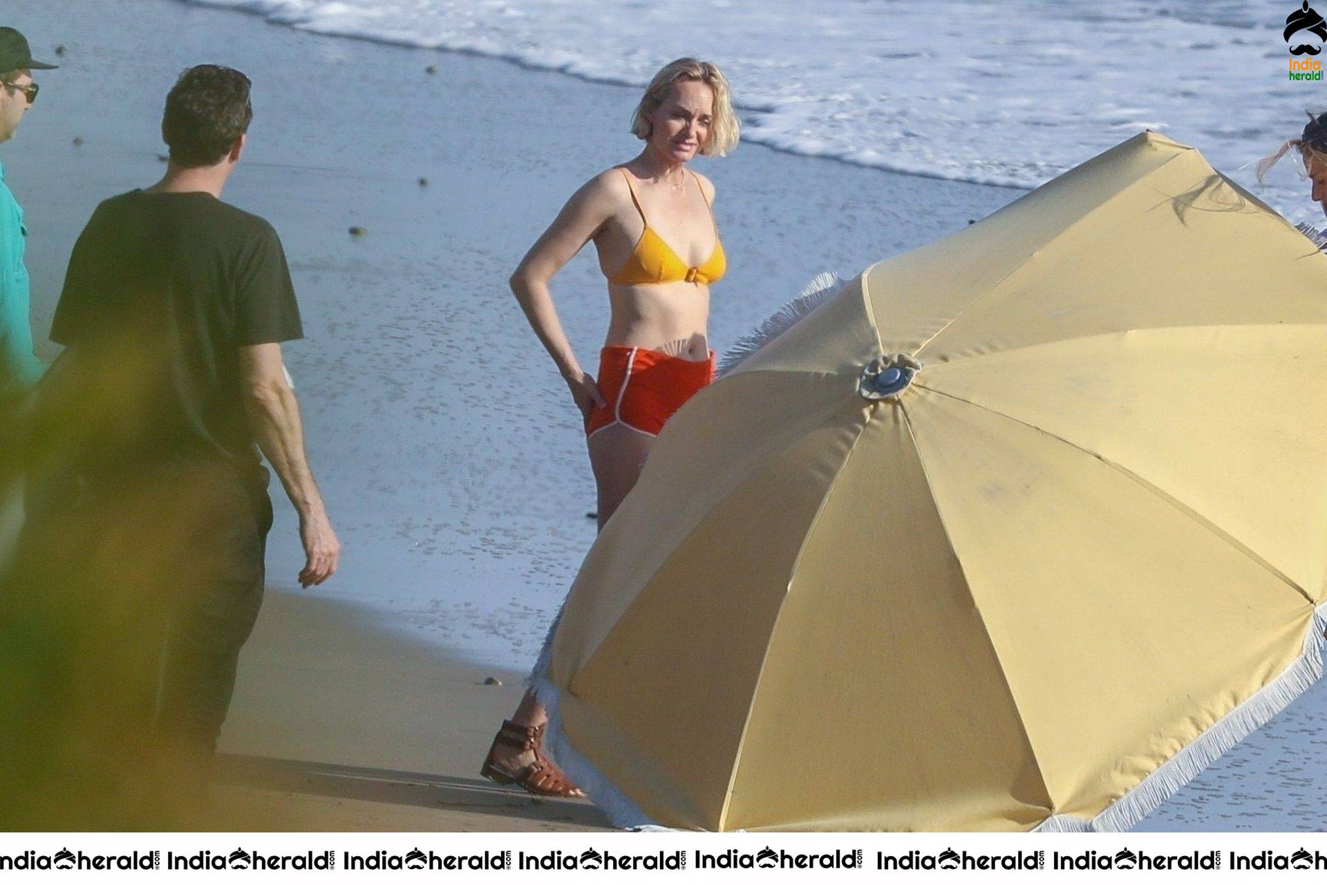 Amber Valletta poses in a bikini on the beach in Malibu