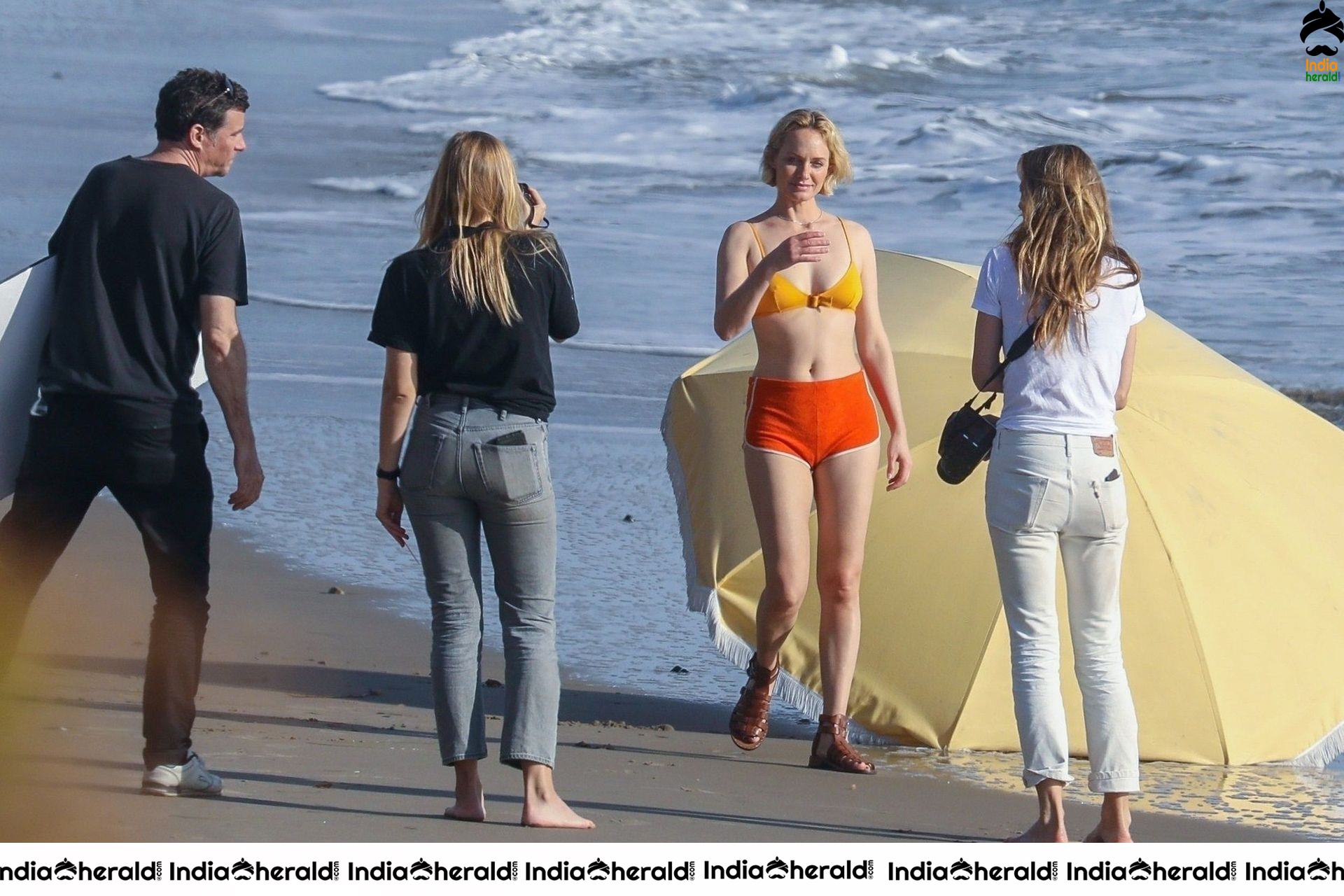 Amber Valletta poses in a bikini on the beach in Malibu