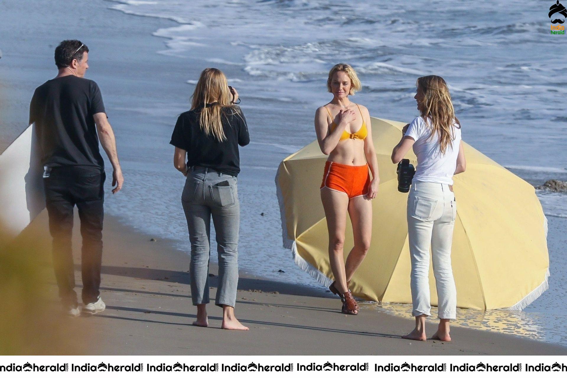 Amber Valletta poses in a bikini on the beach in Malibu