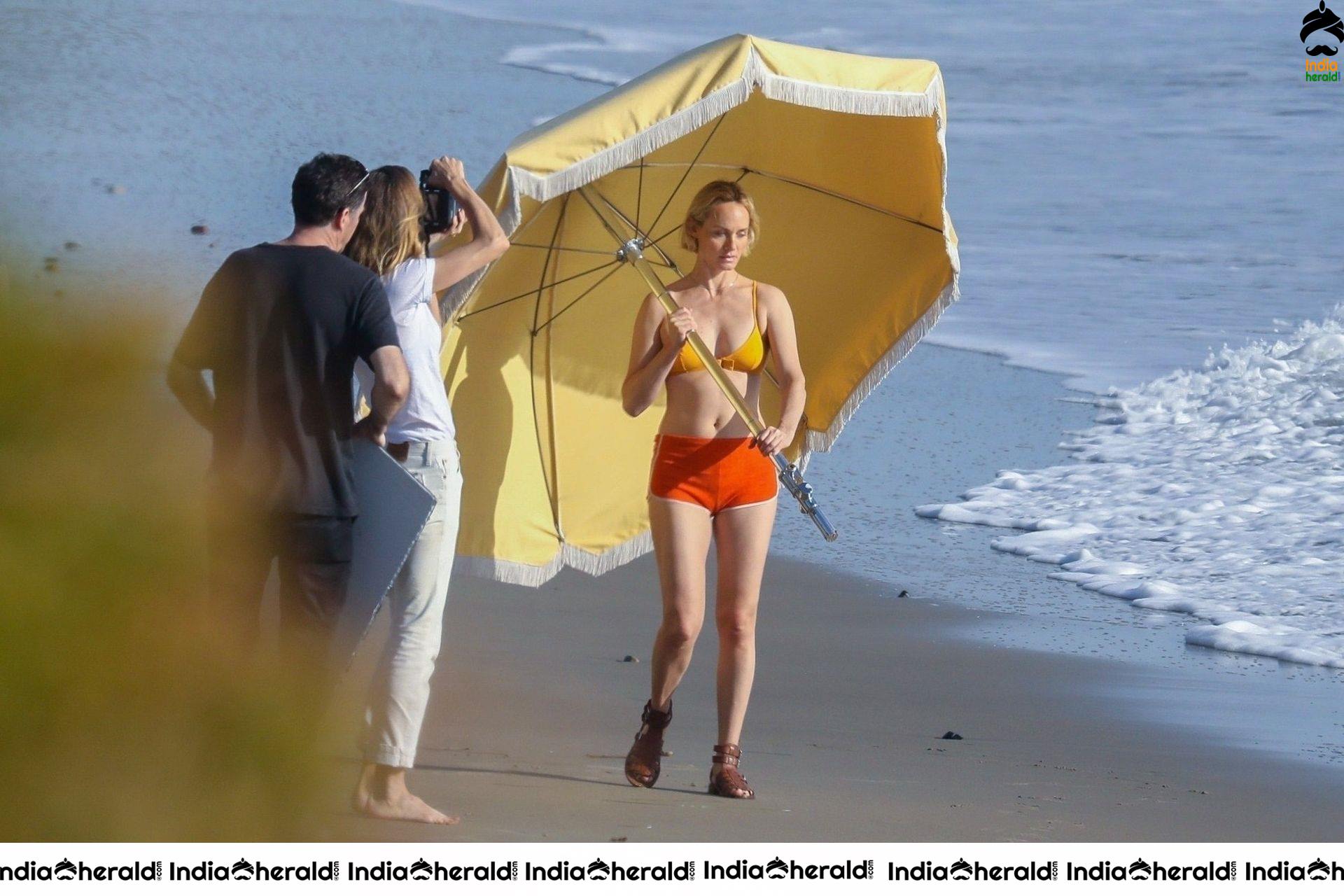 Amber Valletta poses in a bikini on the beach in Malibu