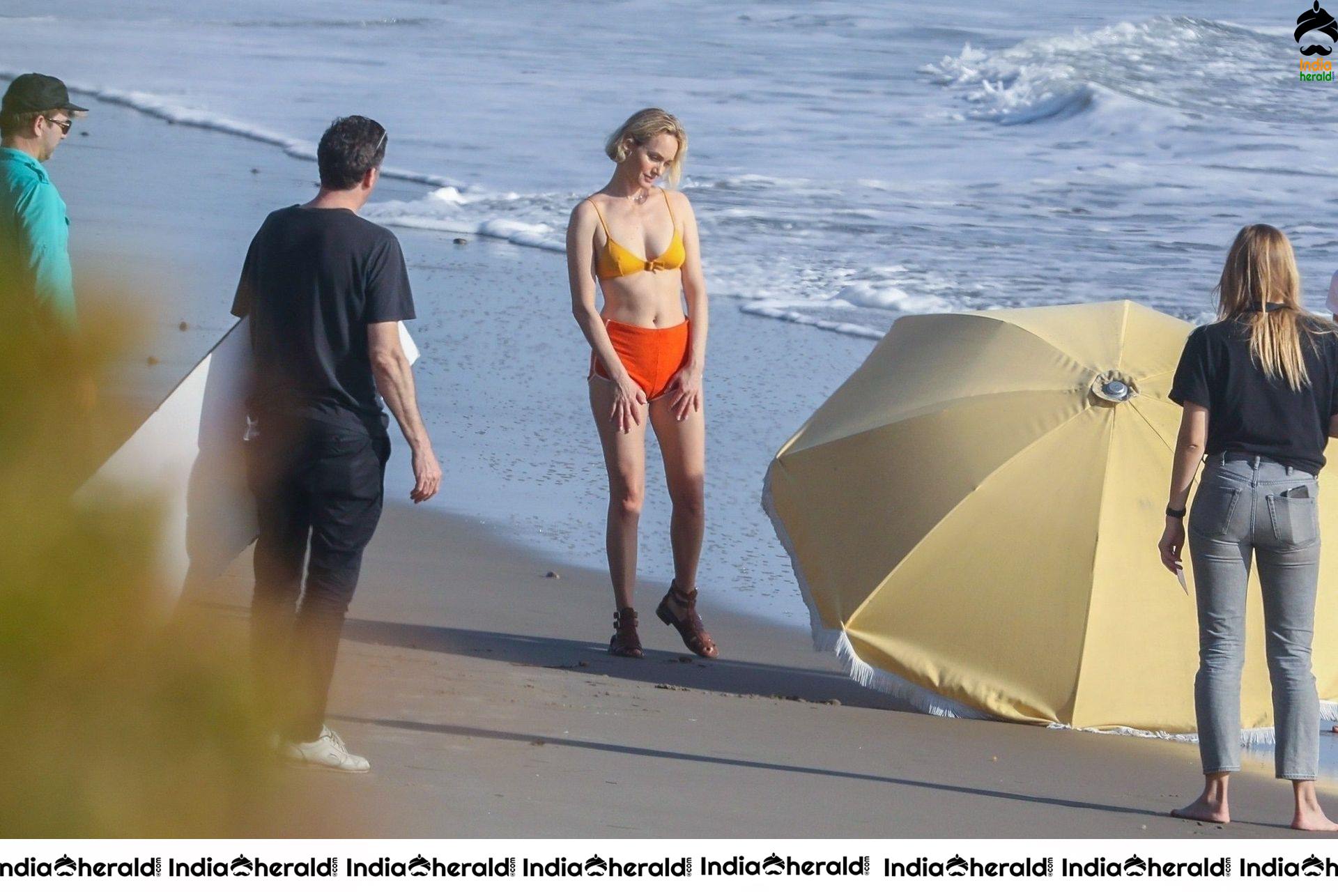 Amber Valletta poses in a bikini on the beach in Malibu