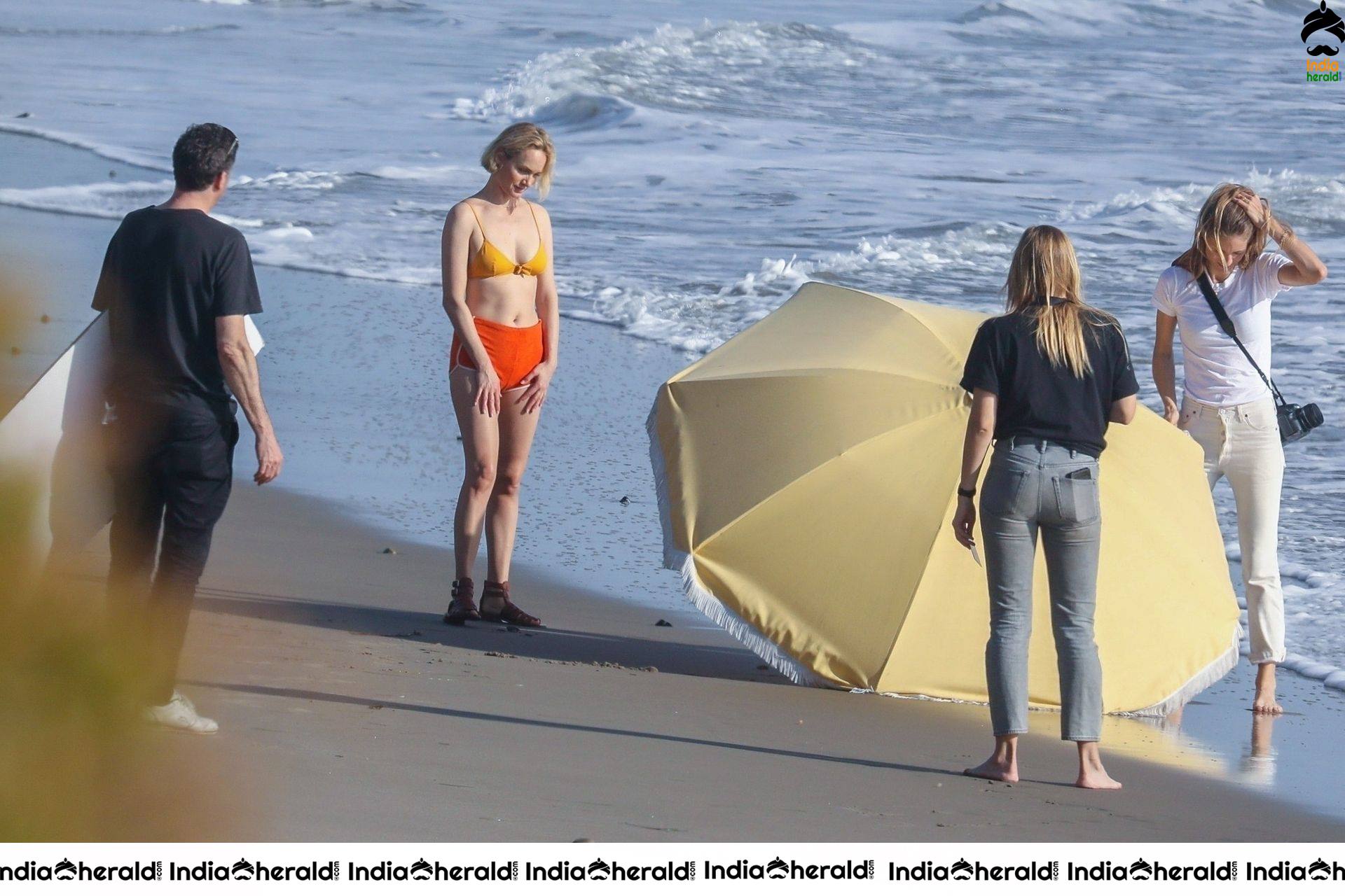 Amber Valletta poses in a bikini on the beach in Malibu