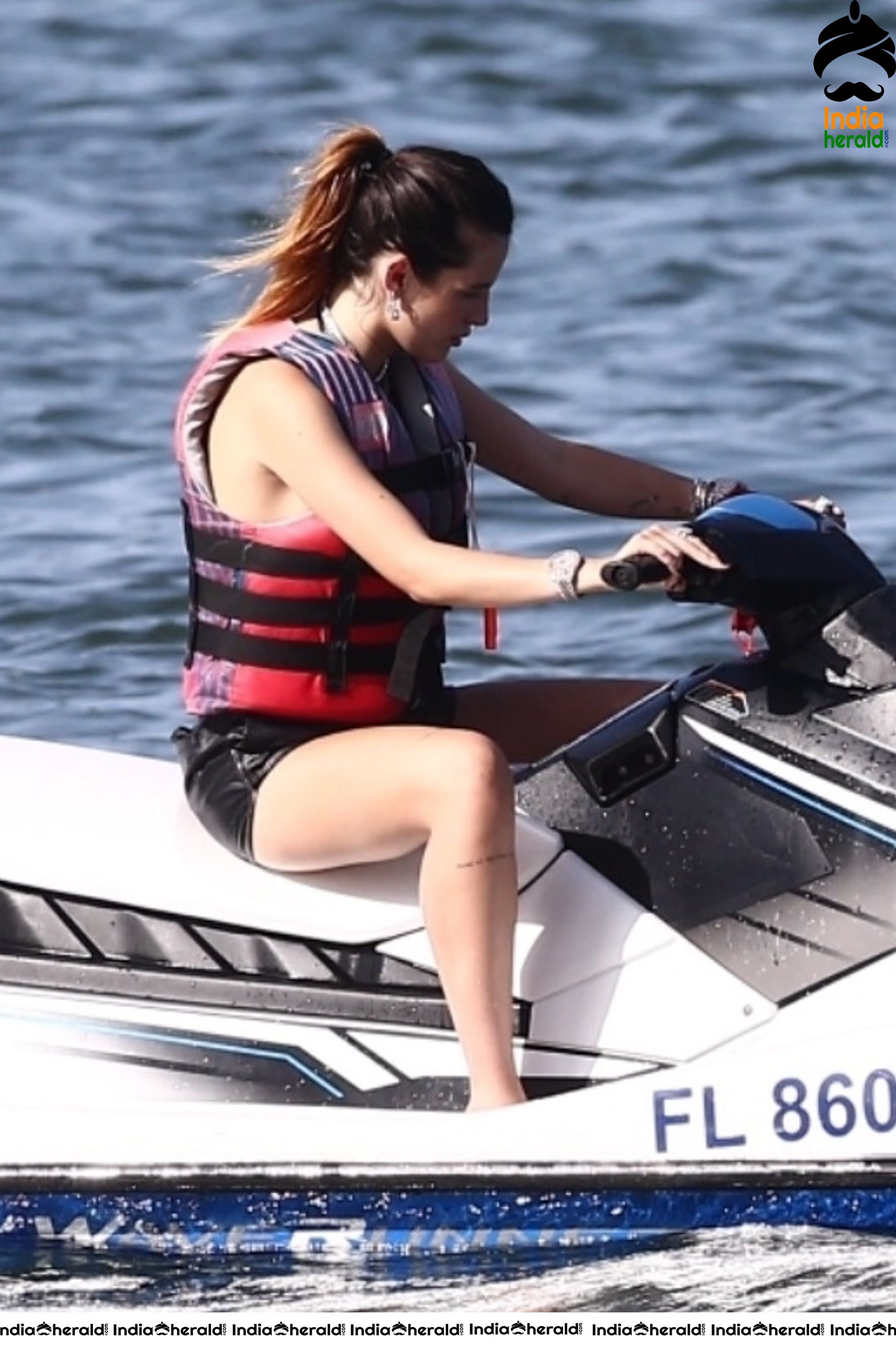 Bella Thorne too hot and tempting in Black Bikini while jet skiing in Miami Set 1