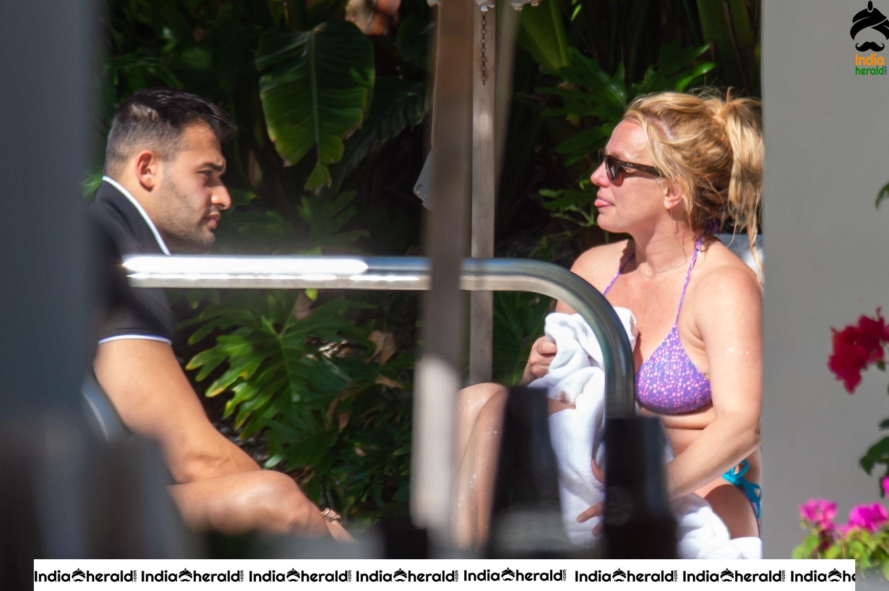 Britney Spears caught in Bikini while sunbathing by poolside in Miami