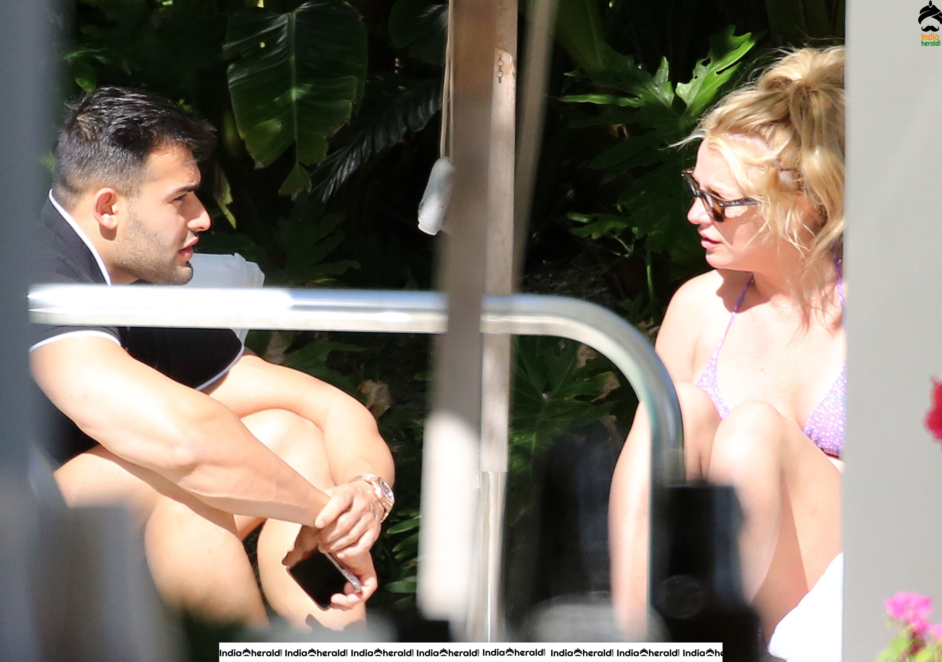 Britney Spears caught in Bikini while sunbathing by poolside in Miami