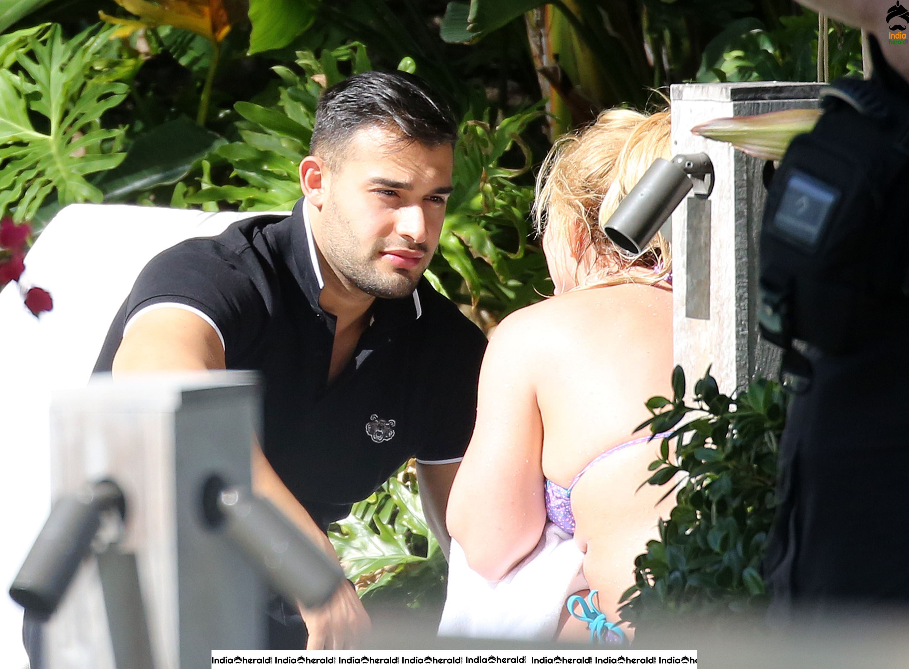 Britney Spears caught in Bikini while sunbathing by poolside in Miami