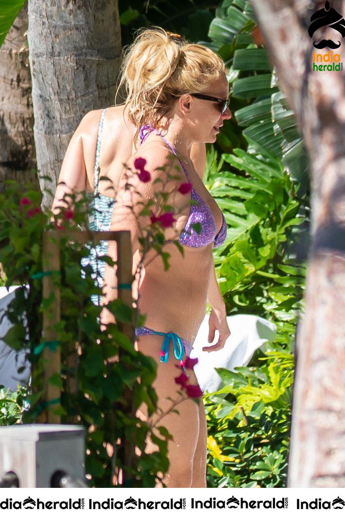 Britney Spears caught in Bikini while sunbathing by poolside in Miami