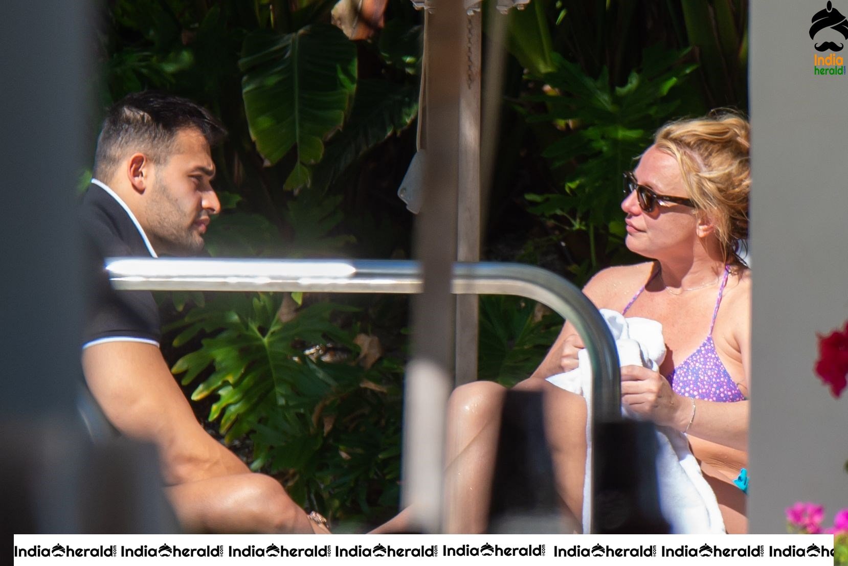 Britney Spears caught in Bikini while sunbathing by poolside in Miami