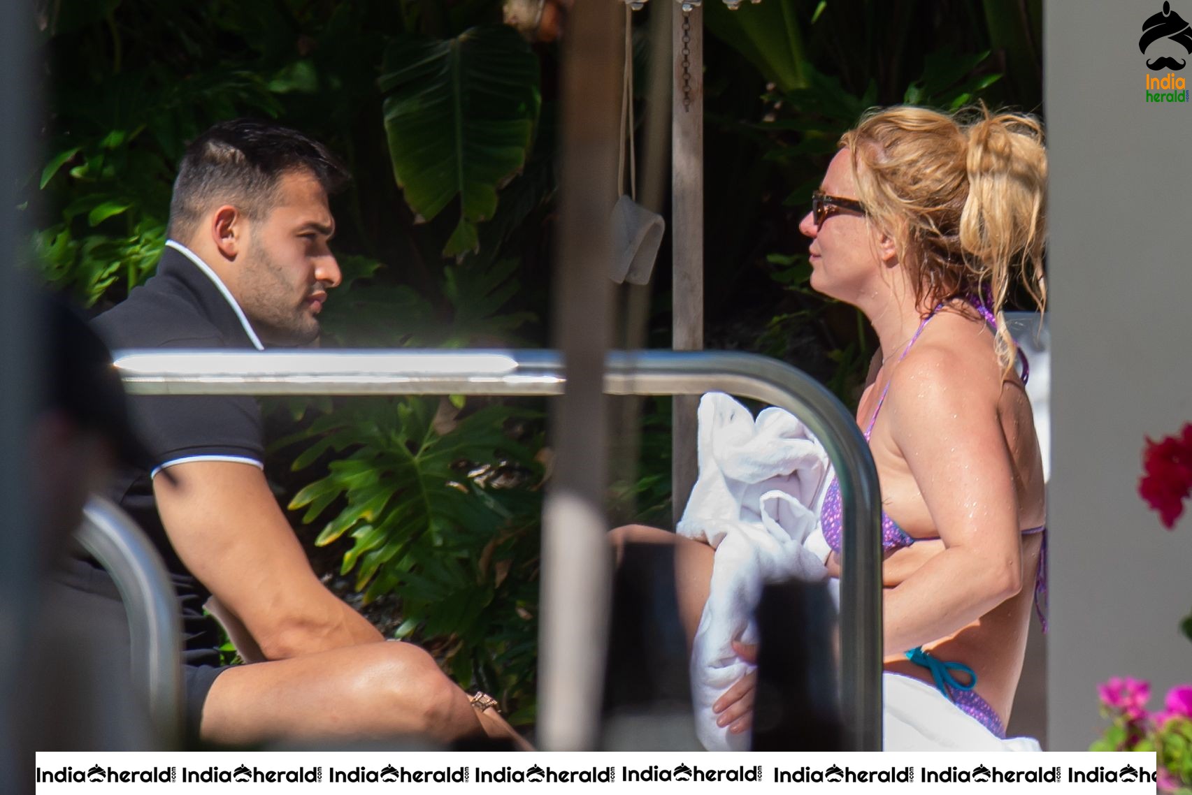 Britney Spears caught in Bikini while sunbathing by poolside in Miami
