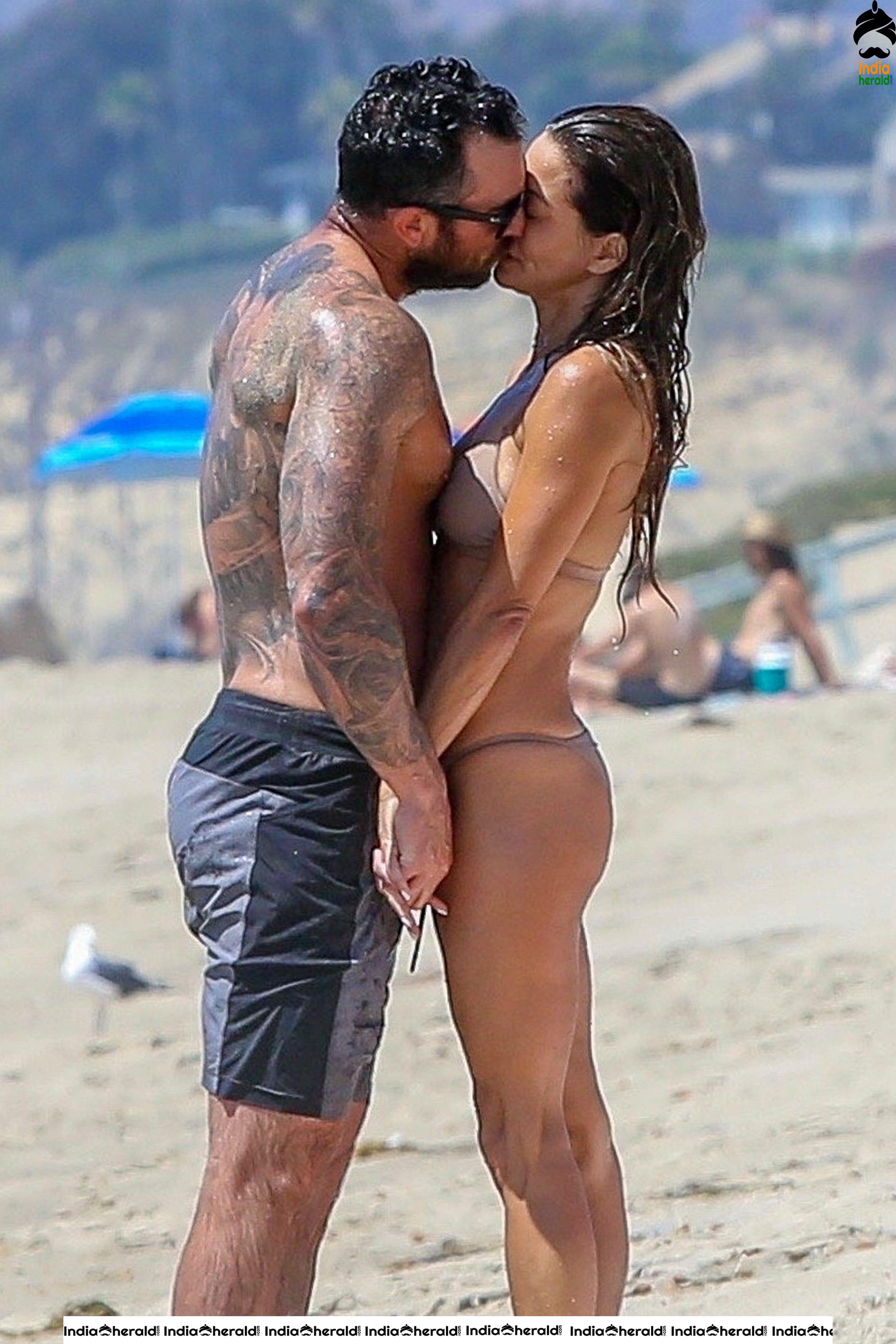 Brooke Burke in Bikini and Enjoying with Boyfriend by Getting Wet on Beach Set 1