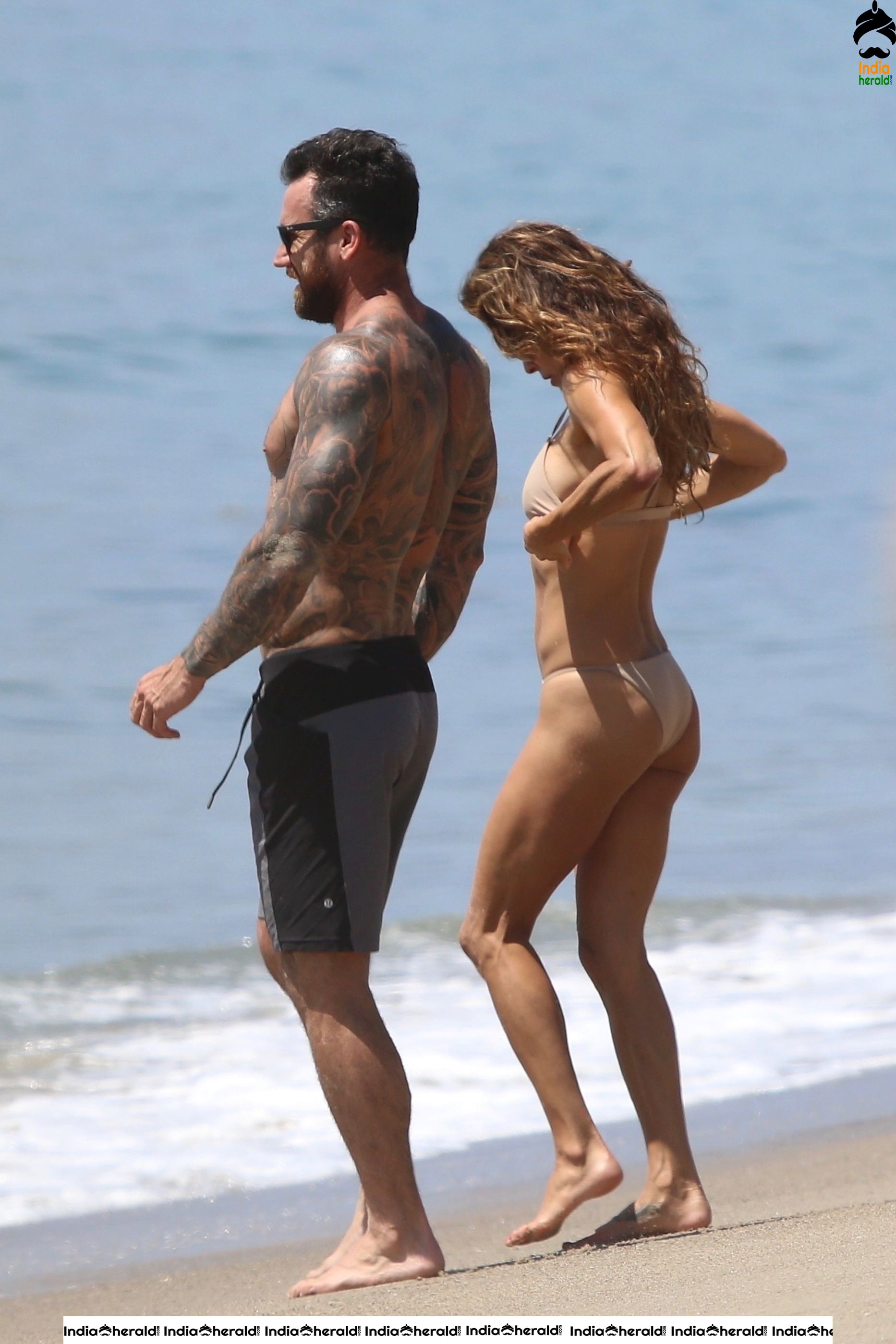 Brooke Burke in Bikini and Enjoying with Boyfriend by Getting Wet on Beach Set 1