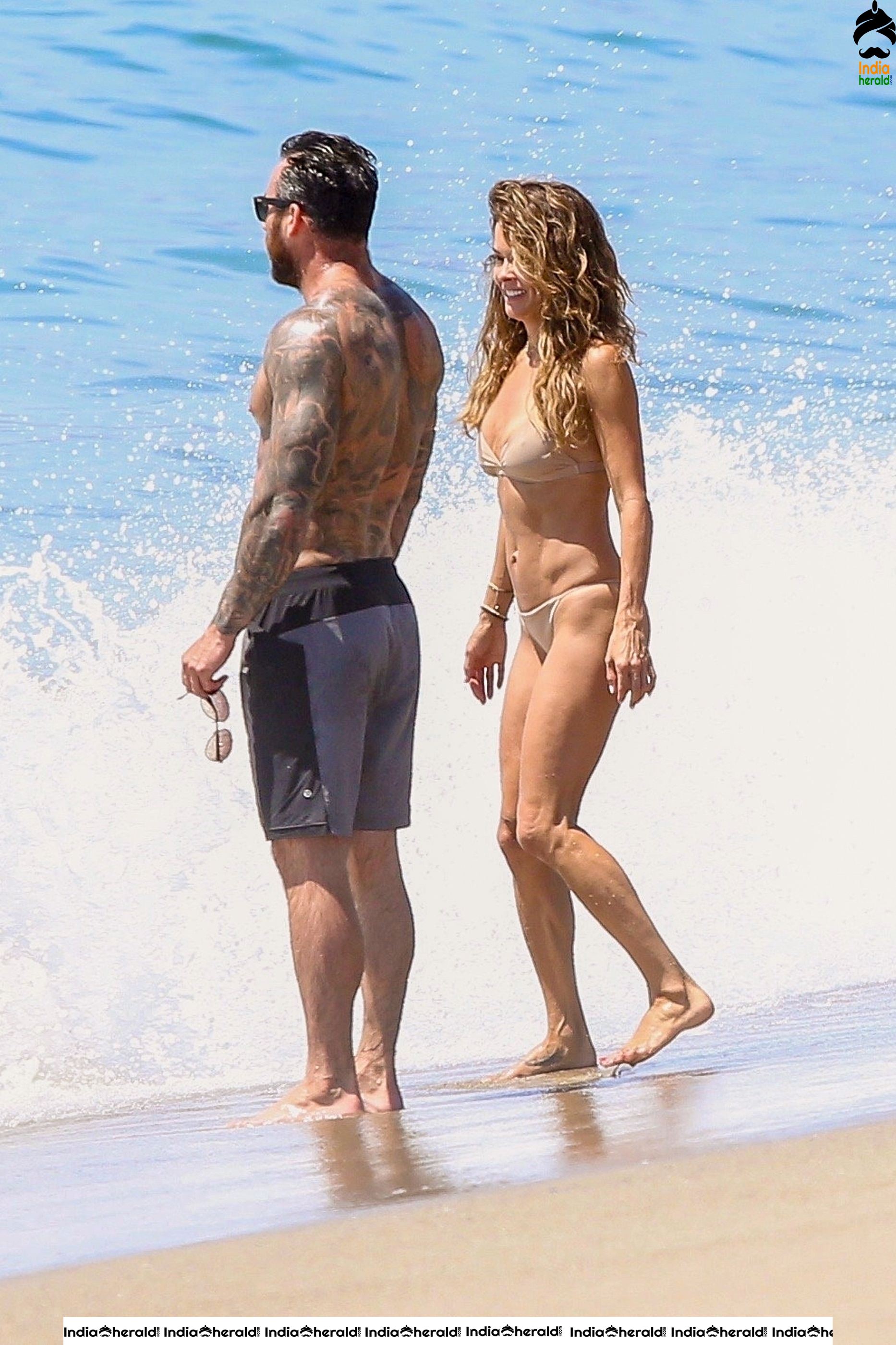 Brooke Burke in Bikini and Enjoying with Boyfriend by Getting Wet on Beach Set 2