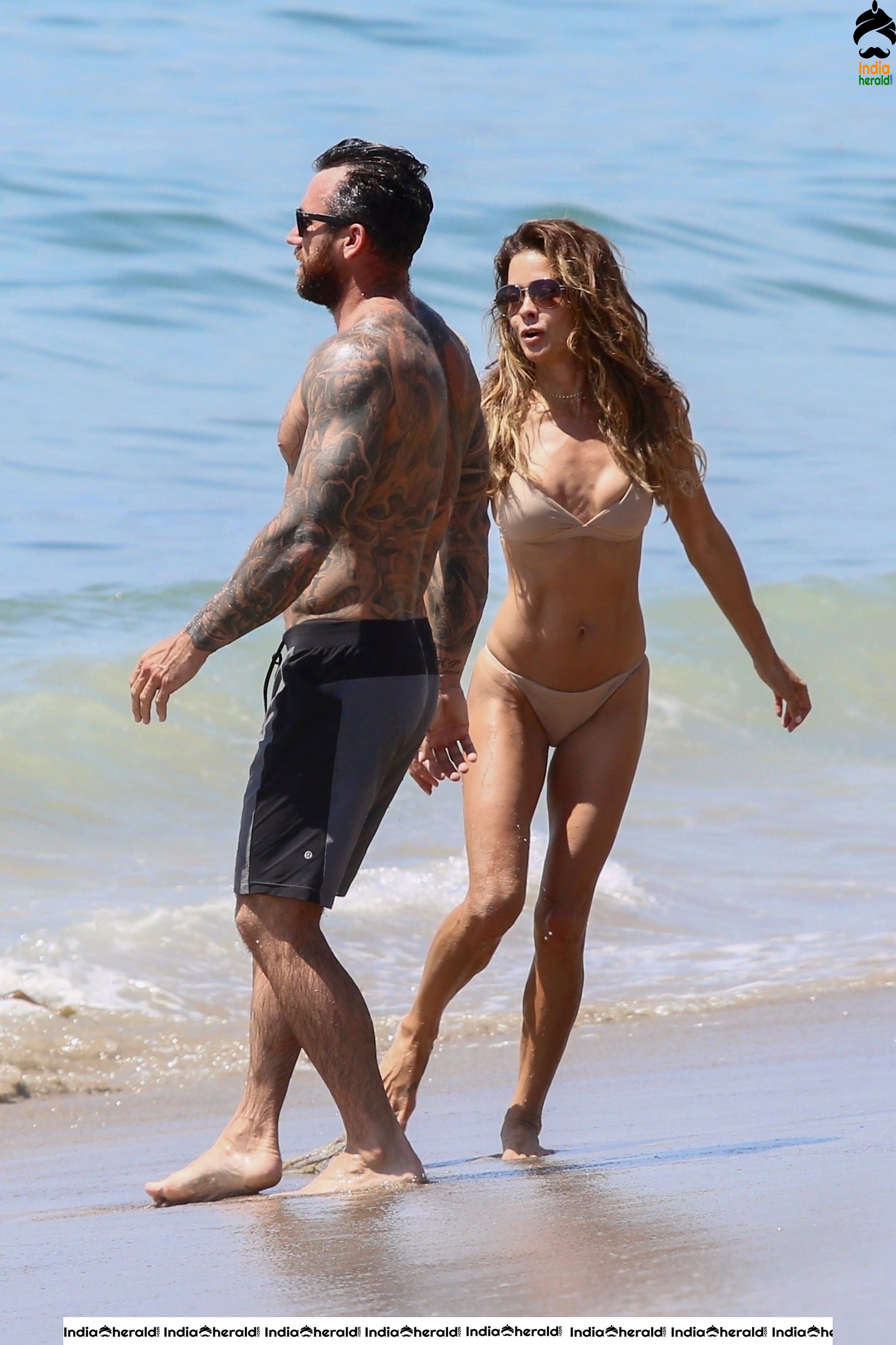 Brooke Burke in Bikini and Enjoying with Boyfriend by Getting Wet on Beach Set 2