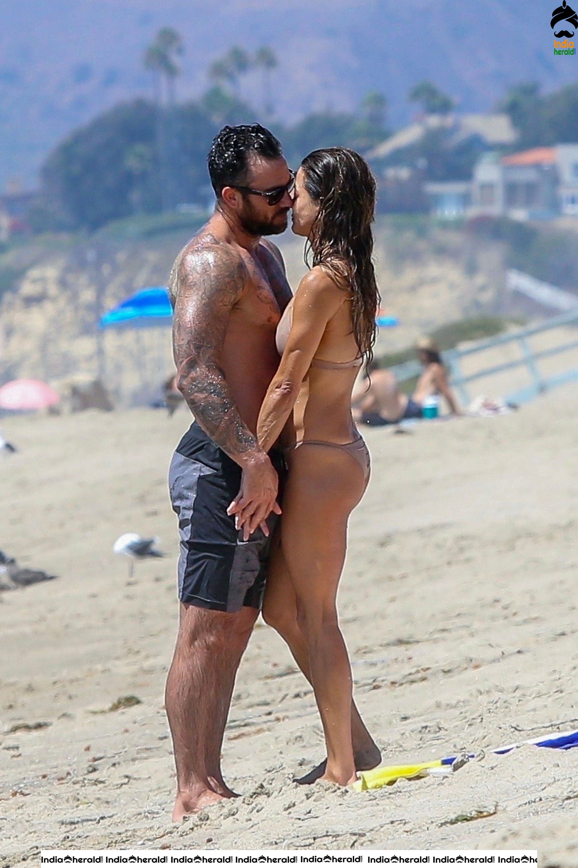 Brooke Burke in Bikini and Enjoying with Boyfriend by Getting Wet on Beach Set 2