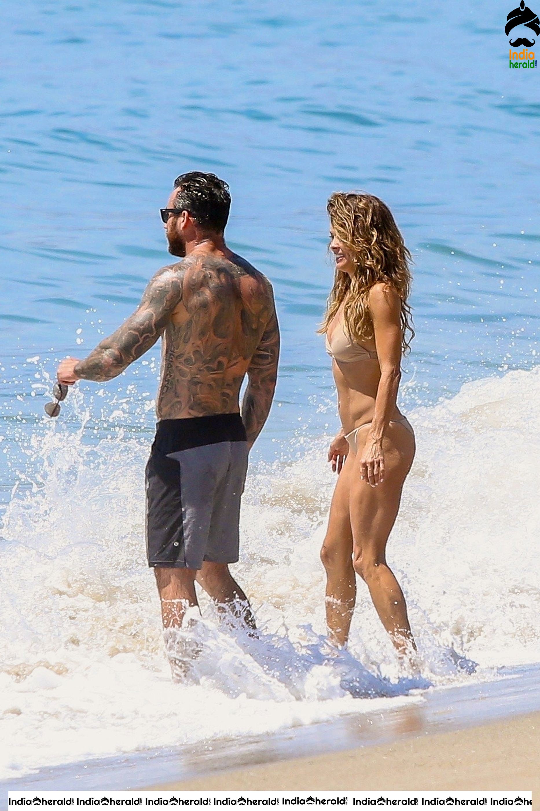 Brooke Burke in Bikini enjoying with Boyfriend on the beach in Malibu Set 2