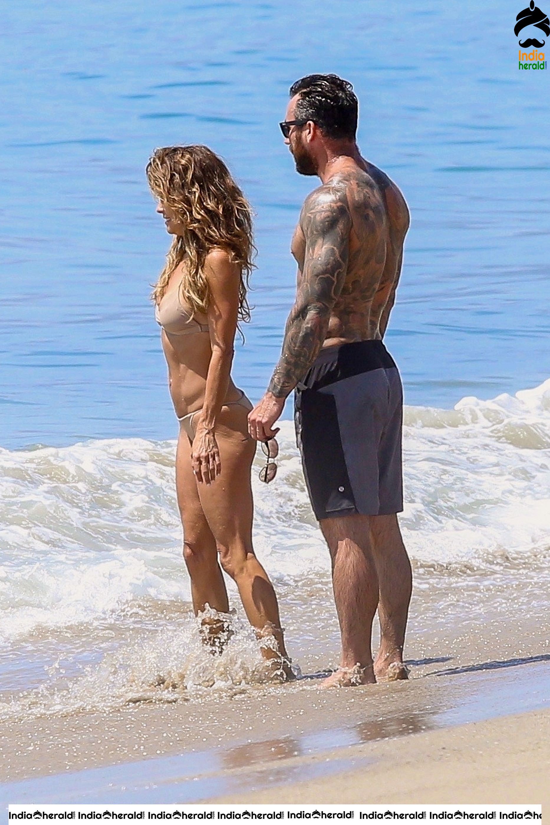 Brooke Burke in Bikini enjoying with Boyfriend on the beach in Malibu Set 2