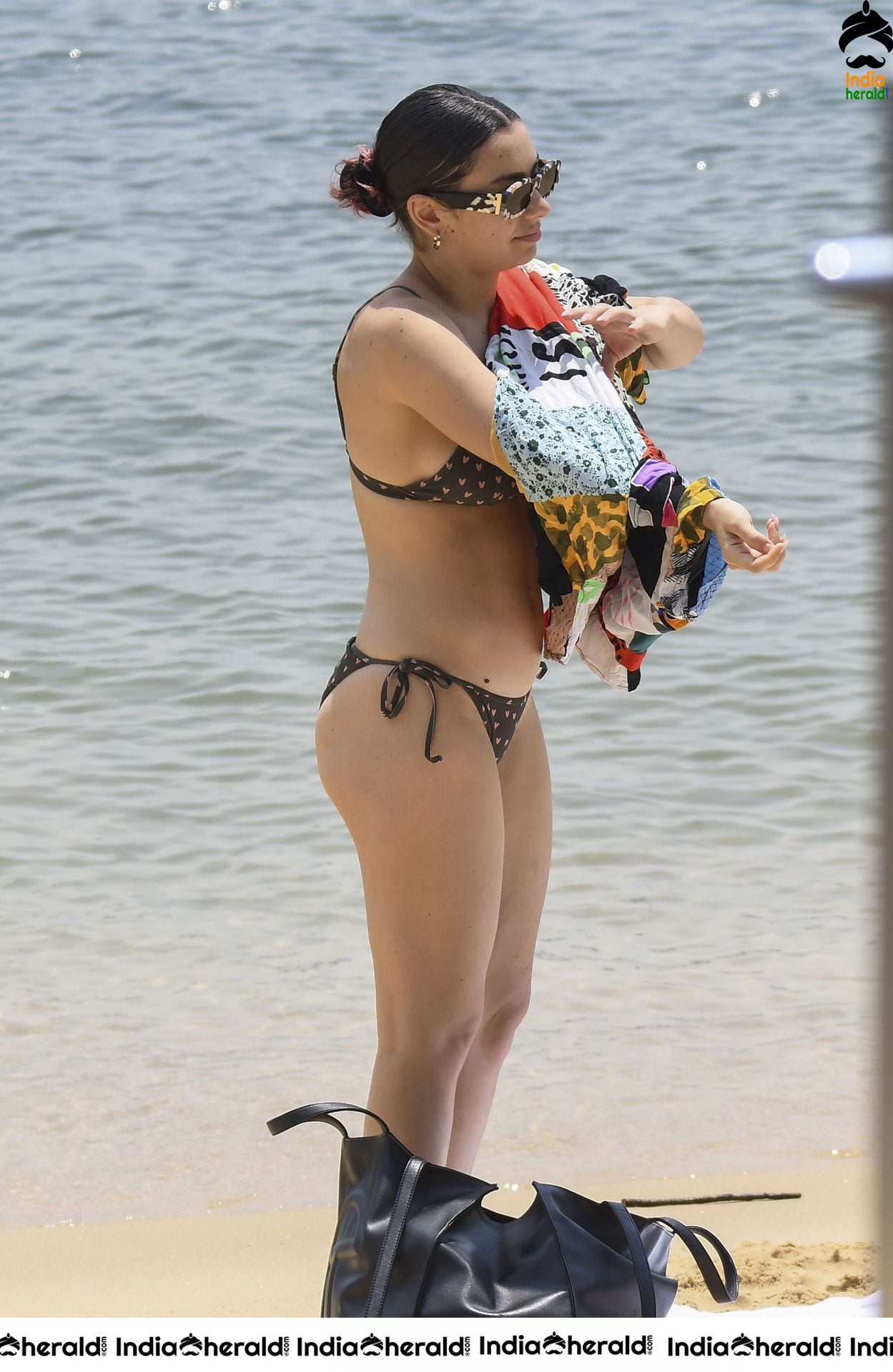 Charli XCX spotted cooling off in a bikiniat a Sydney Beach