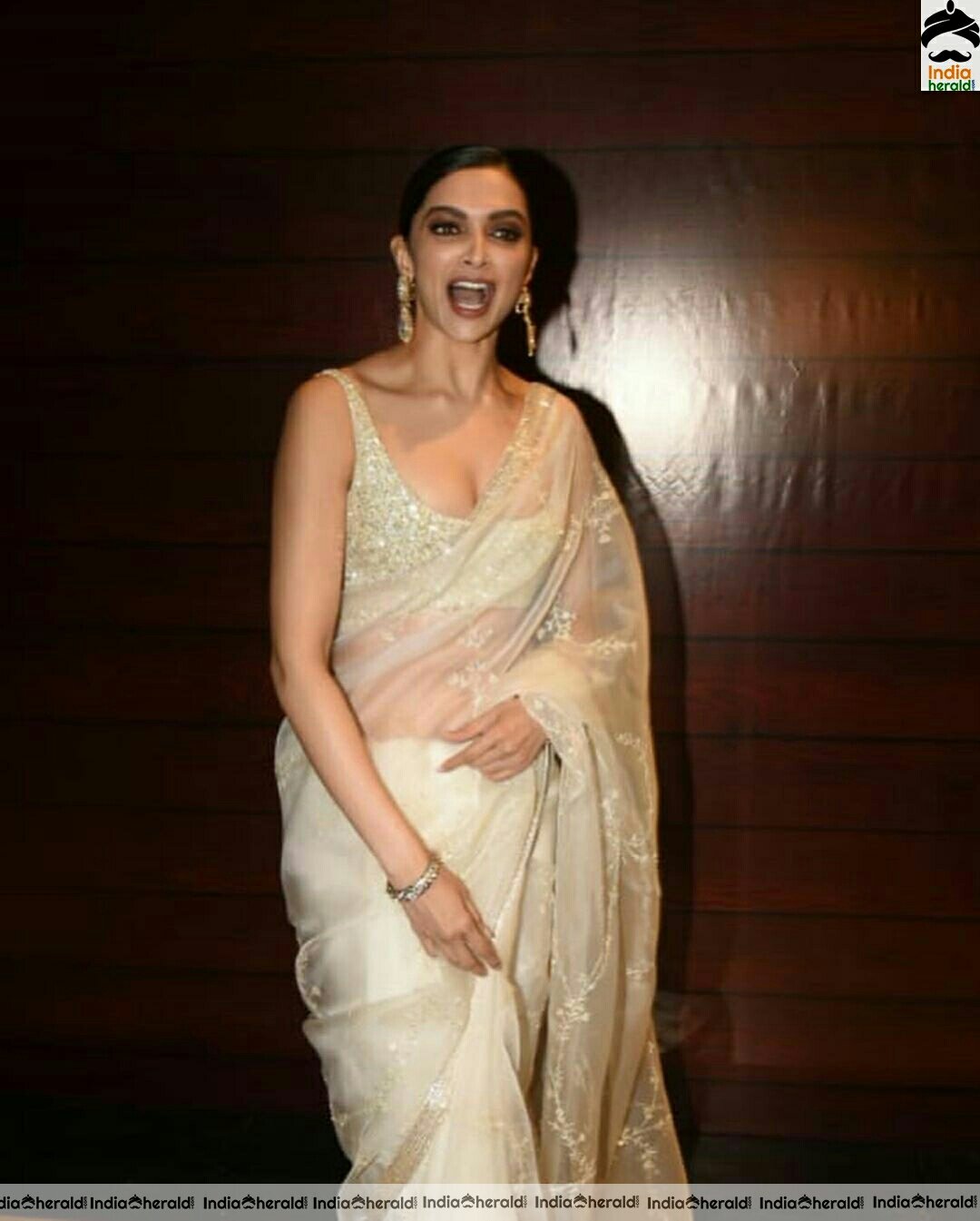 Deepika padukone Sexy Hot In Sleeveless Blouse In Cream Net Transparent Saree Stills