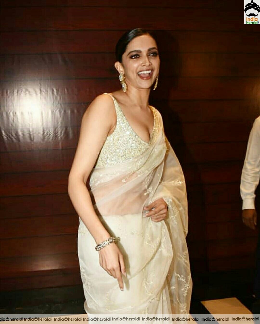 Deepika padukone Sexy Hot In Sleeveless Blouse In Cream Net Transparent Saree Stills