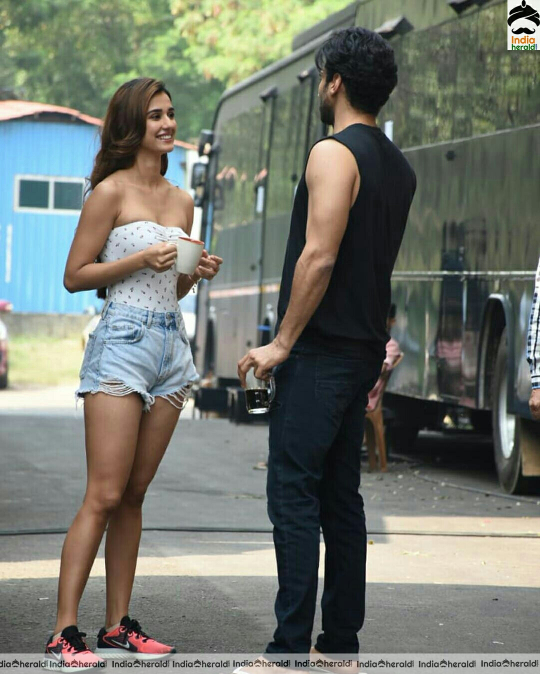 Disha Patani showing cleavage in Tube top and thighs in sexy shorts