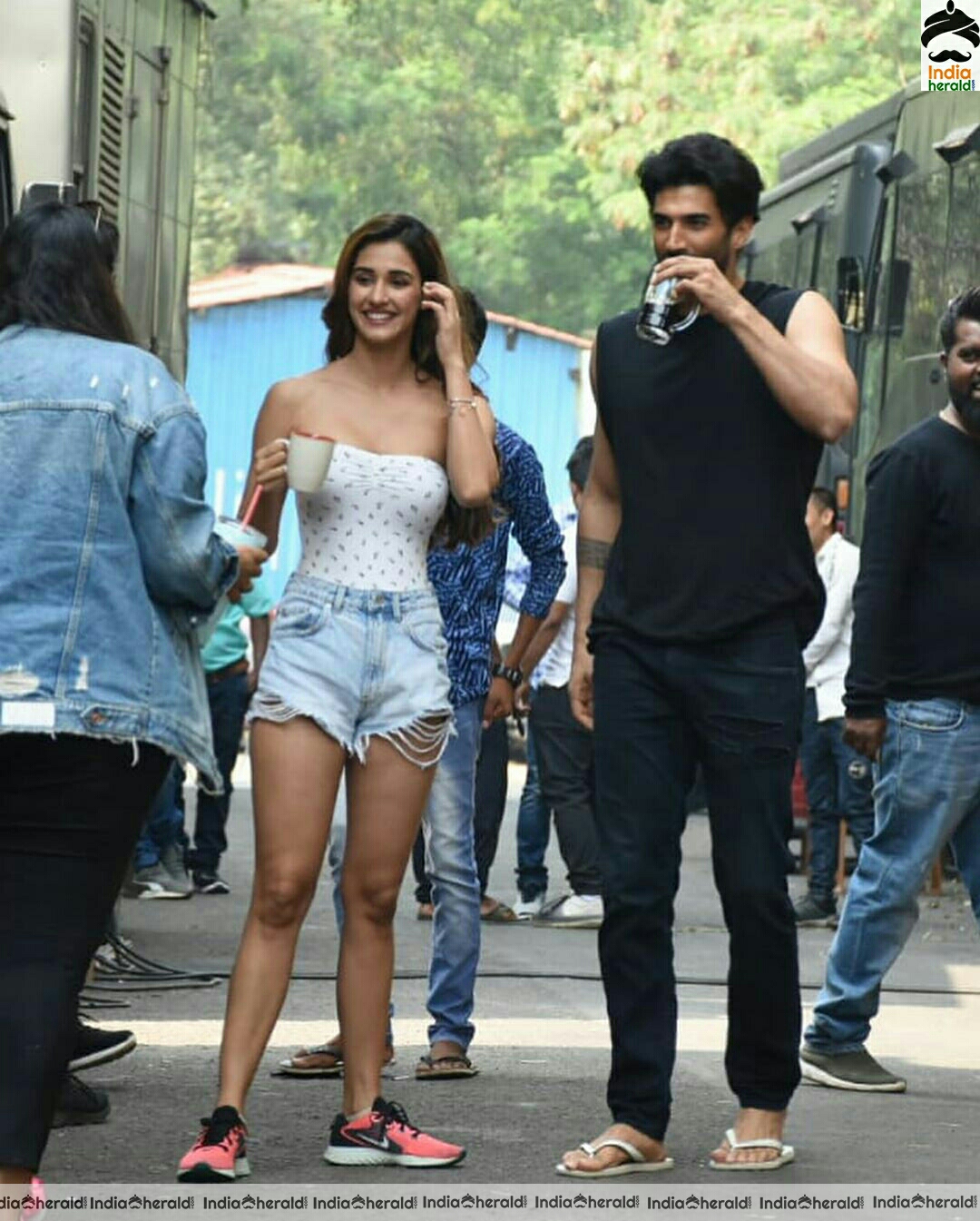 Disha Patani showing cleavage in Tube top and thighs in sexy shorts