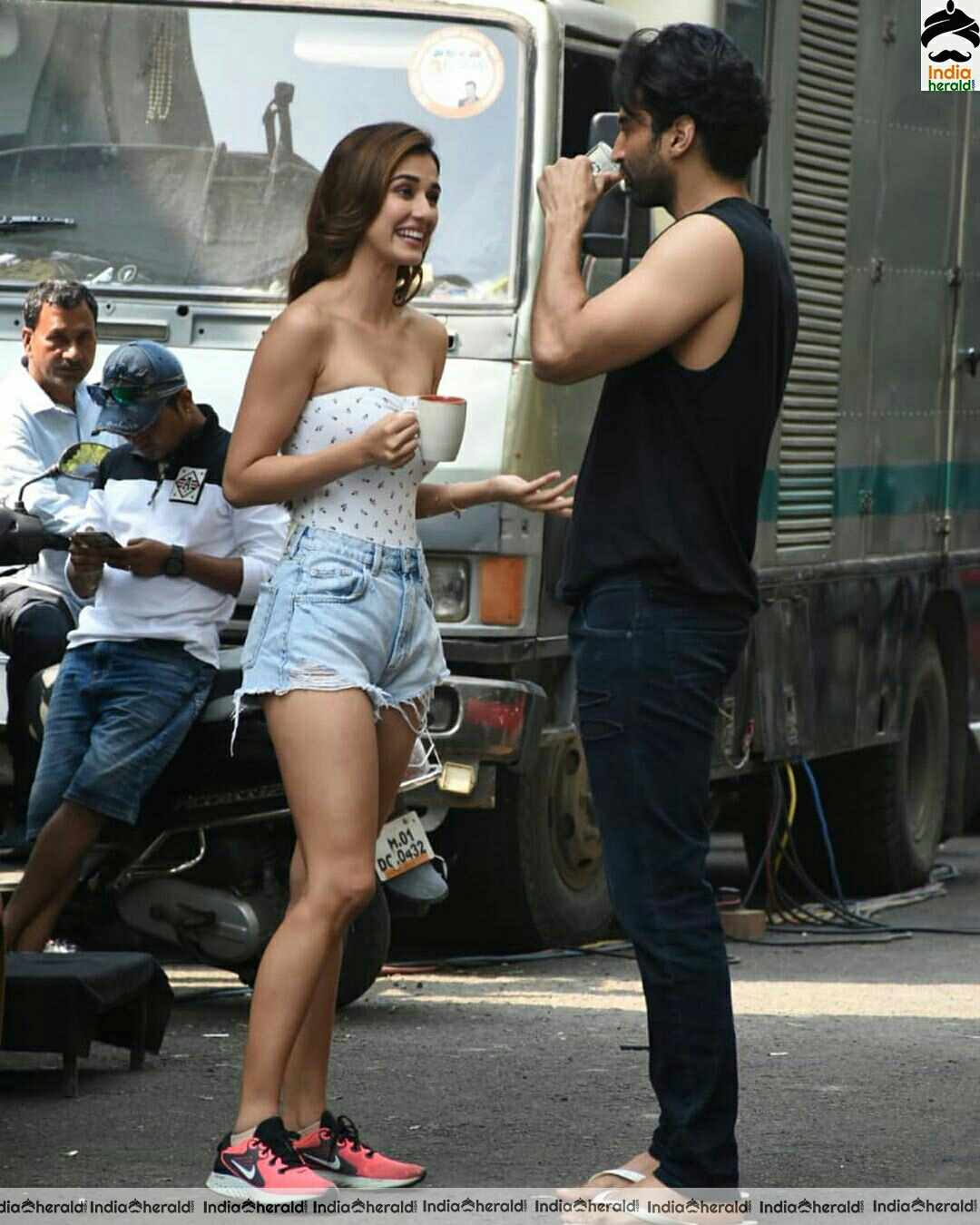 Disha Patani showing cleavage in Tube top and thighs in sexy shorts