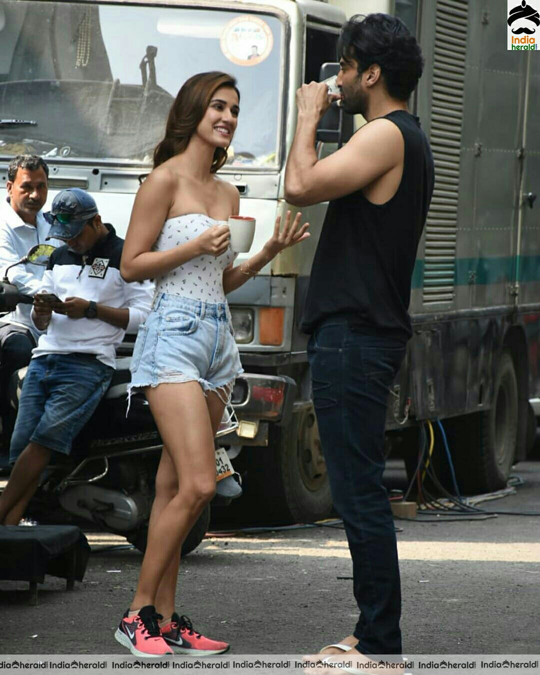 Disha Patani showing cleavage in Tube top and thighs in sexy shorts