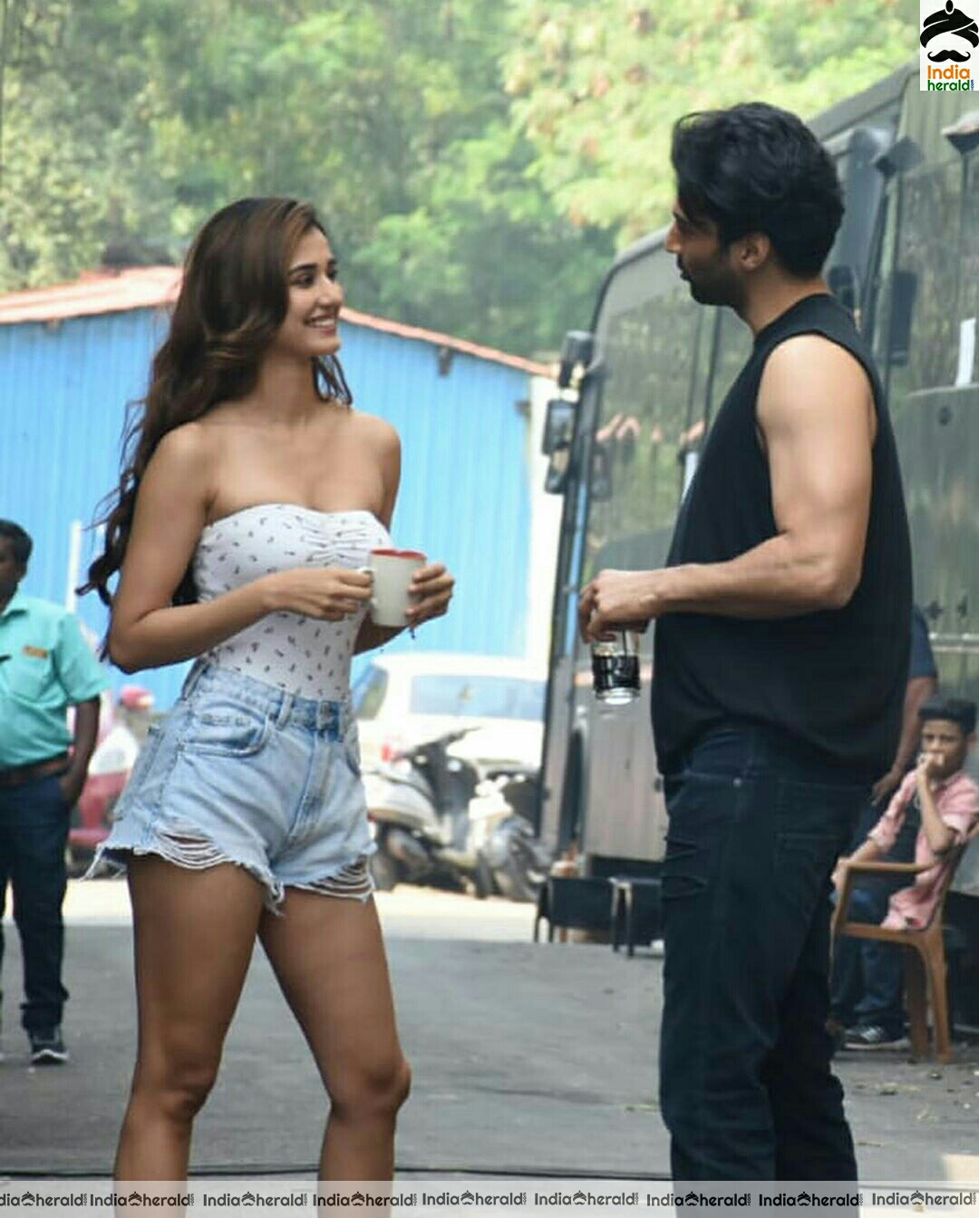Disha Patani showing cleavage in Tube top and thighs in sexy shorts