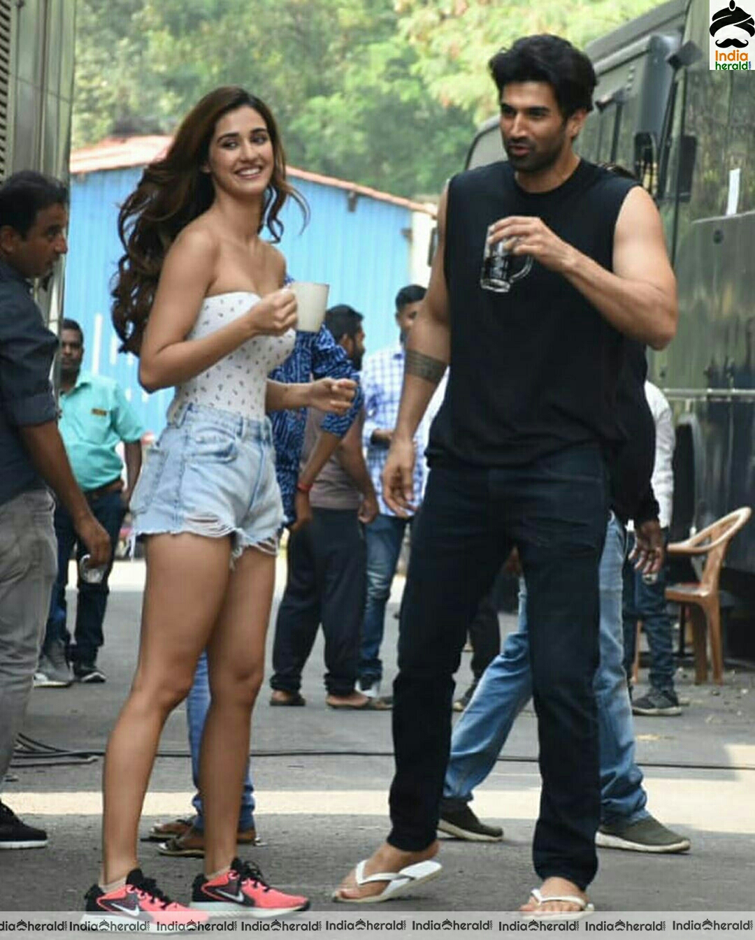 Disha Patani showing cleavage in Tube top and thighs in sexy shorts